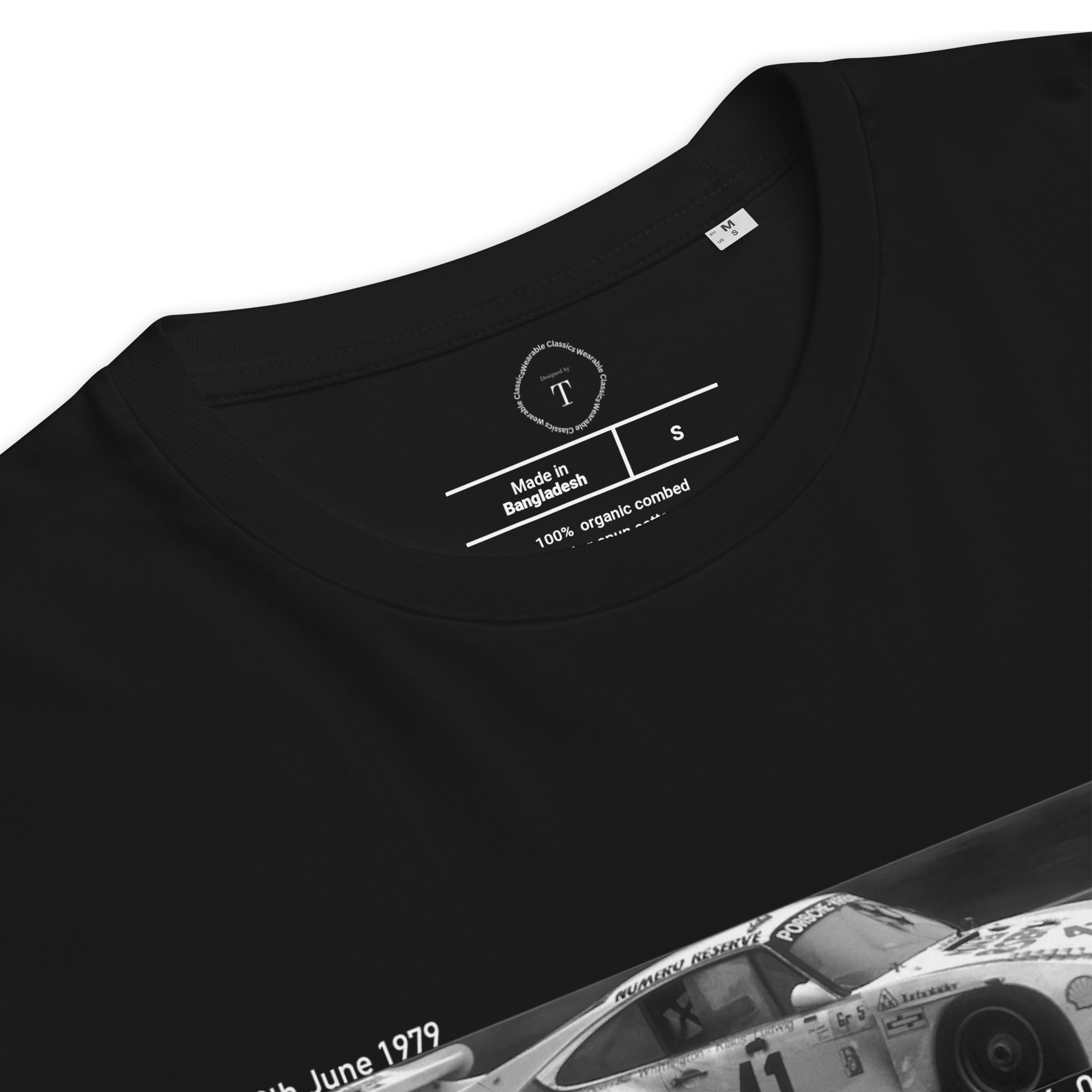 Black Unisex Cotton T-Shirt folded close up with banner image of Porsche 1979 at Le Mans in the centre with text of coordinates and date of race