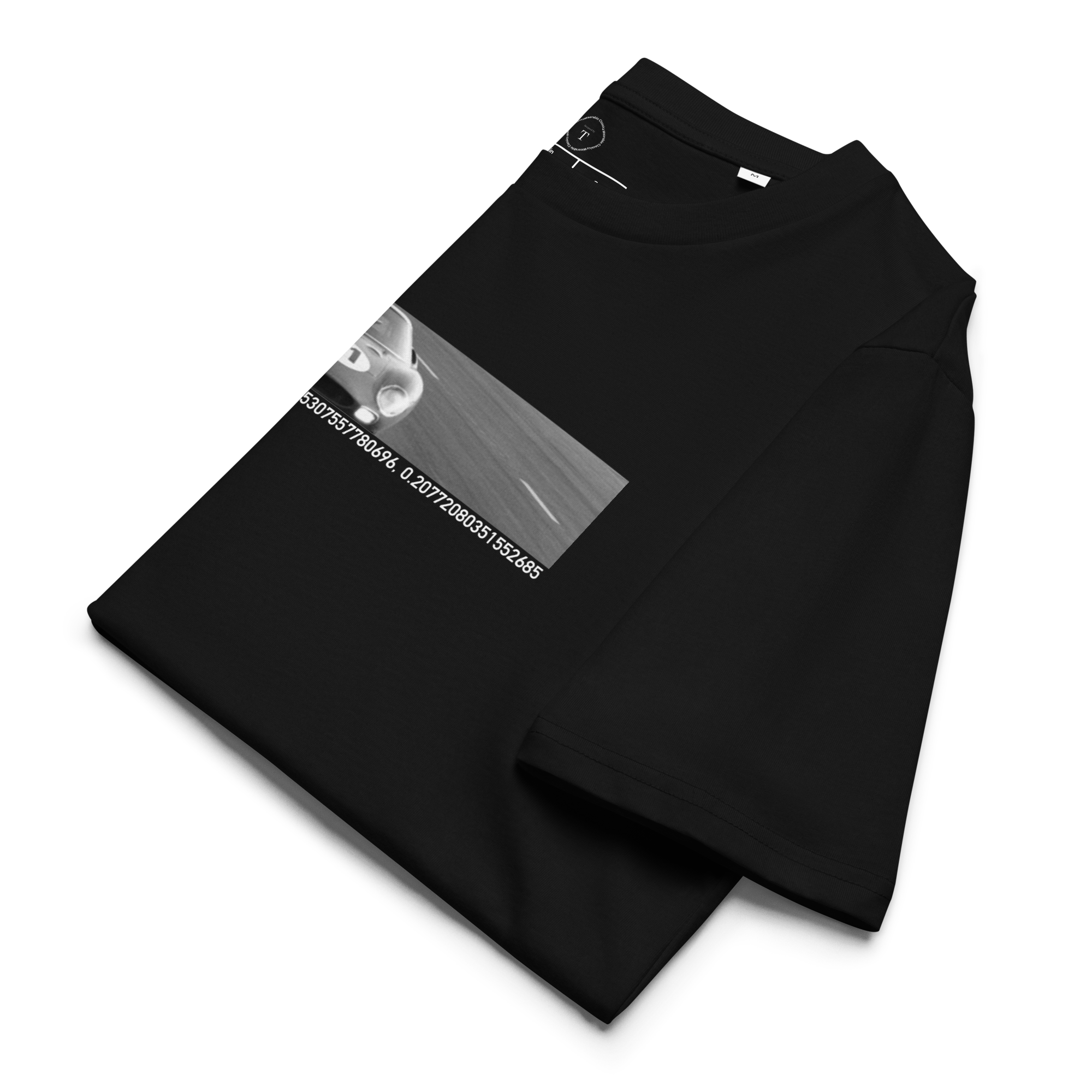 Black Unisex Cotton T-Shirt folded close up with banner image of 1965 Ferrari at Le Mans in the centre with text of coordinates and date of race