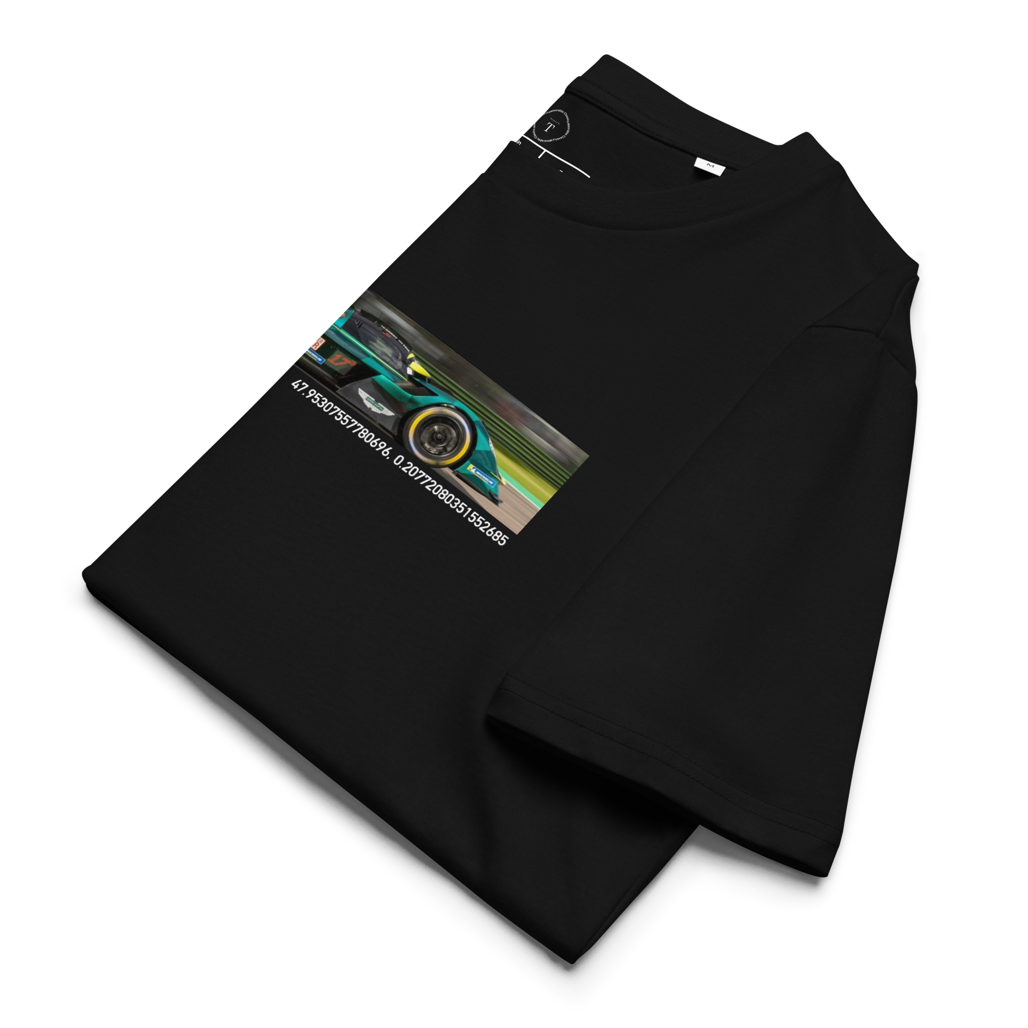 Black Unisex Cotton T-Shirt folded close up with banner image of Aston Martin Valkyrie at Le Mans in the centre with text of coordinates and date of race