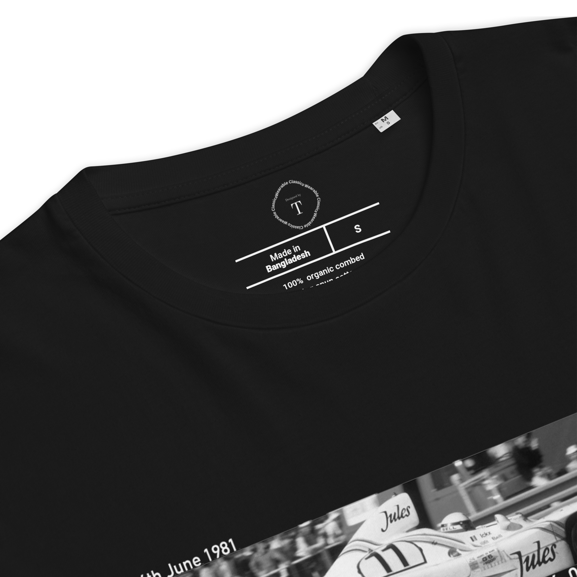 Black Unisex Cotton T-Shirt folded close up with banner image of Porsche 1981 at Le Mans in the centre with text of coordinates and date of race