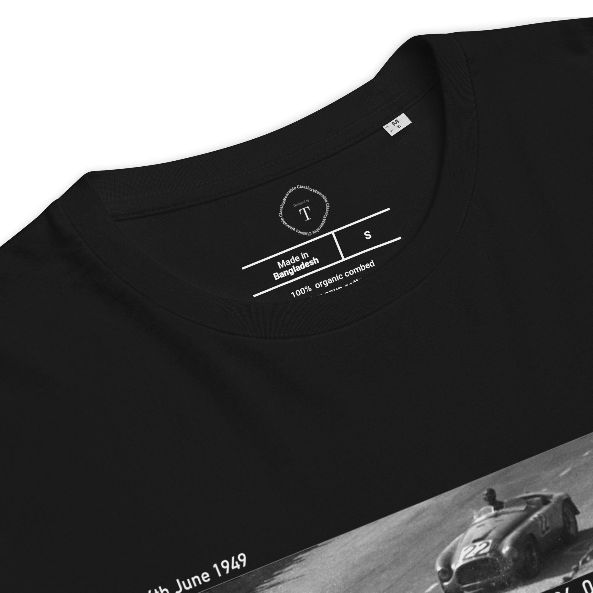 Black Unisex Cotton T-Shirt folded close up with banner image of 1949 Victor Ferrari at Le Mans in the centre with text of coordinates and date of race