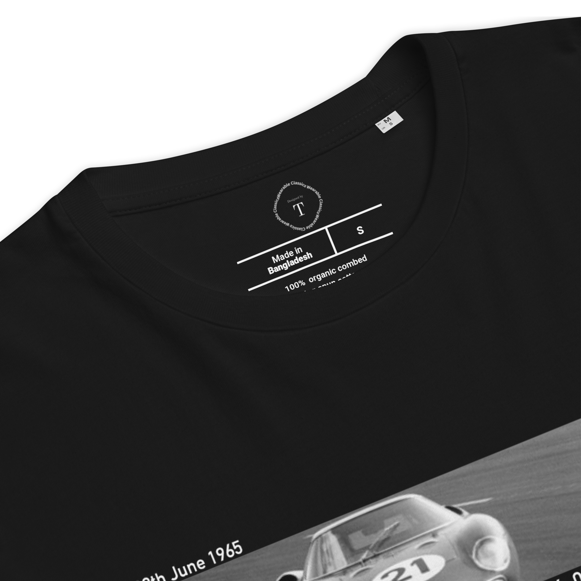 Black Unisex Cotton T-Shirt folded close up with banner image of 1965 Ferrari at Le Mans in the centre with text of coordinates and date of race