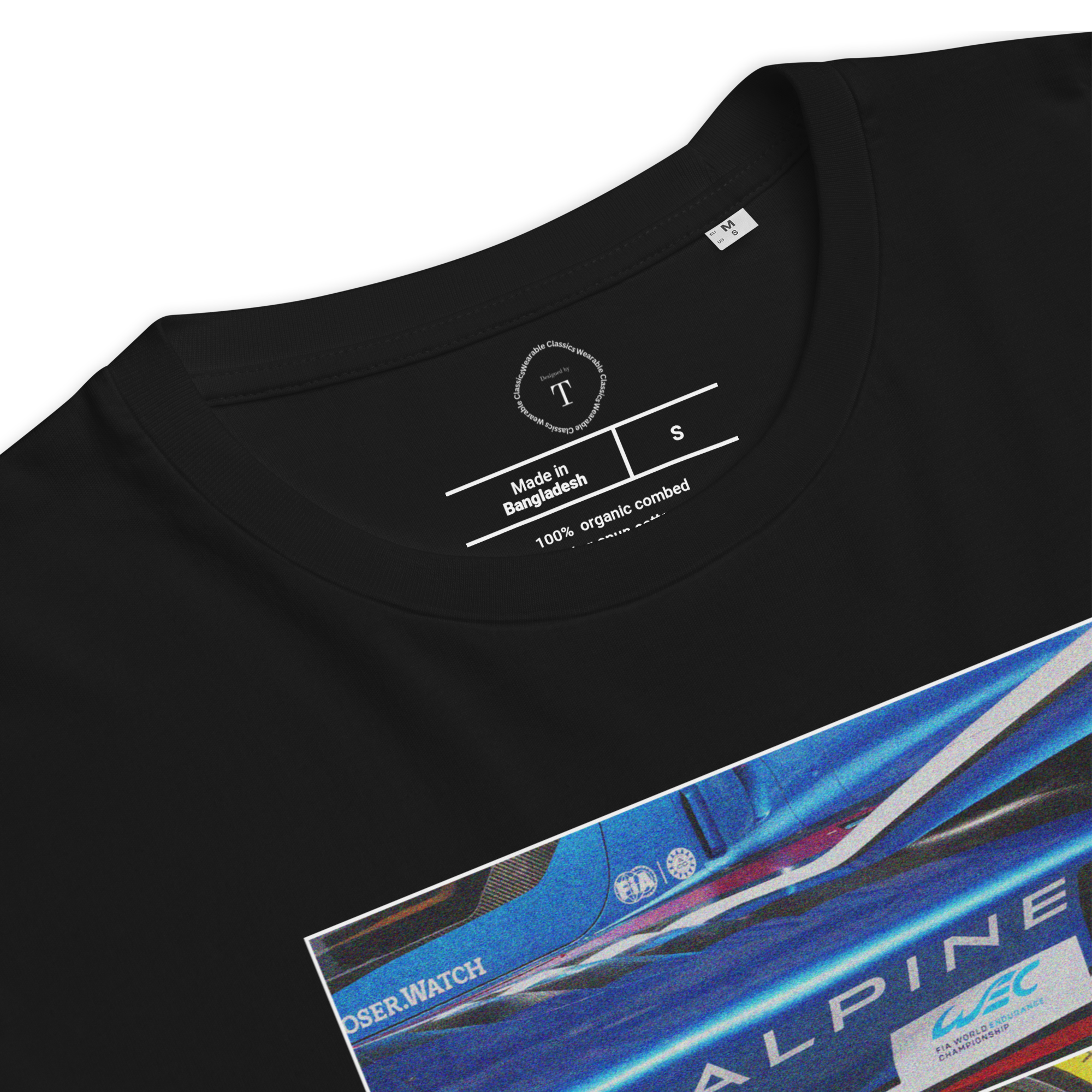 Black Unisex Cotton T-Shirt folded close up with sqaure box design with photographs of Alpine from multiple angles at Le Mans