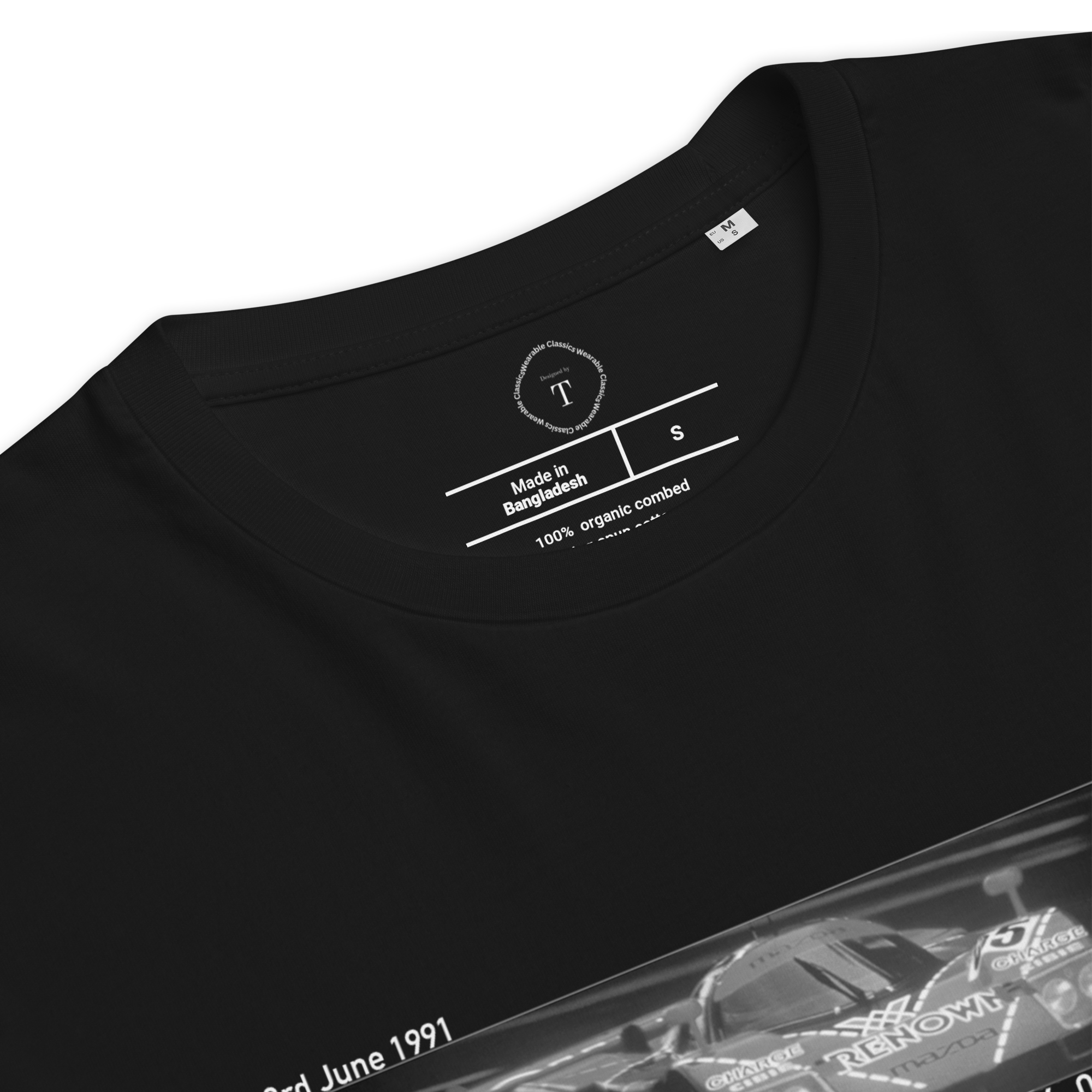 Black Unisex Cotton T-Shirt folded close up with banner image of Mazda 787B 1991 at Le Mans in the centre with text of coordinates and date of race