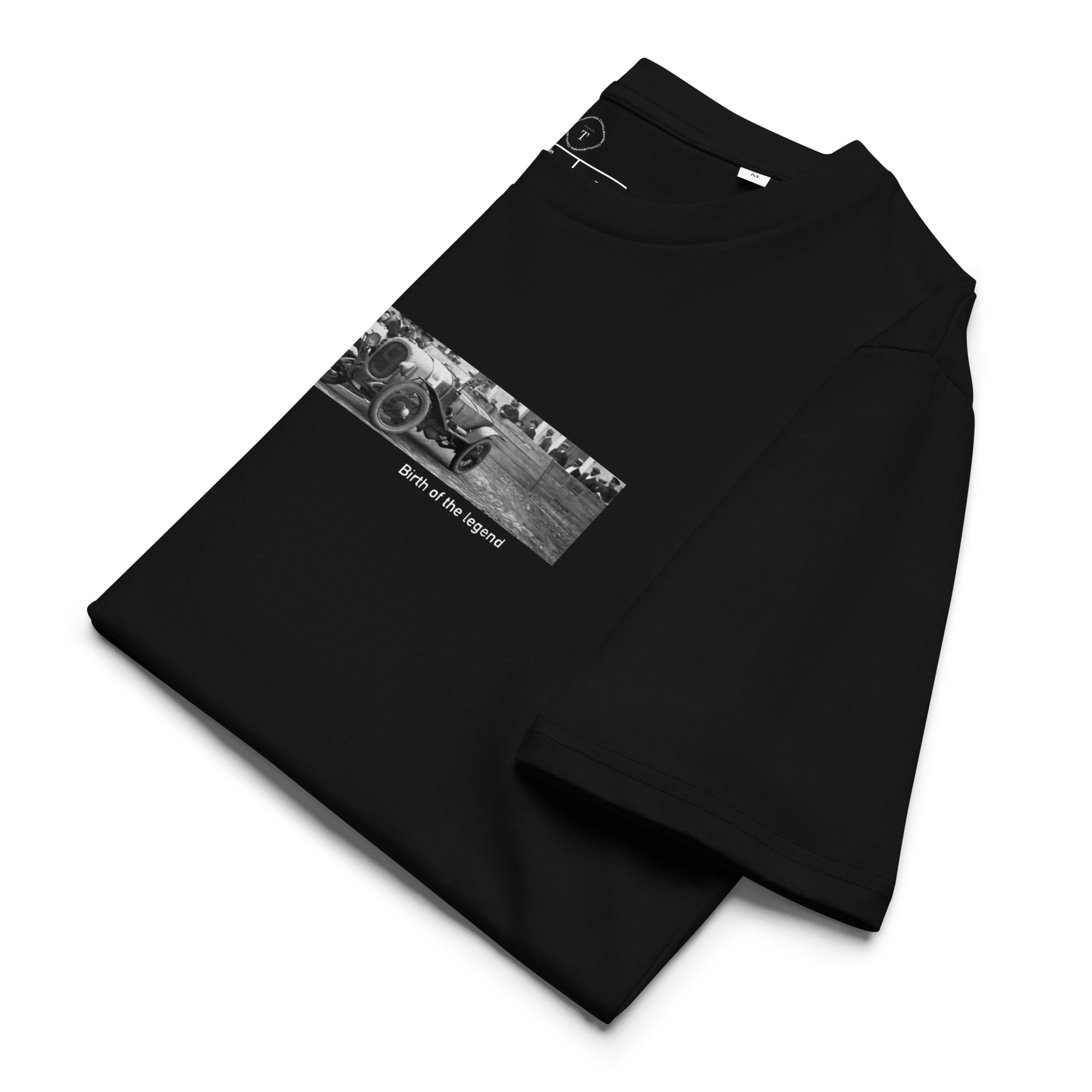 Black Unisex Cotton T-Shirt folded close up with banner image of Le Mans 1923 Victor in the centre with text of coordinates and date of race