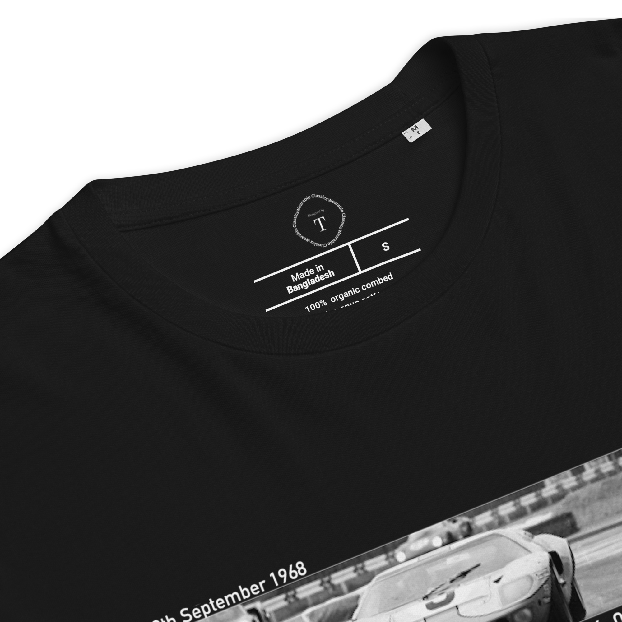 Black Unisex Cotton T-Shirt folded close up with banner image of Ford GT40 1968 at Le Mans in the centre with text of coordinates and date of race