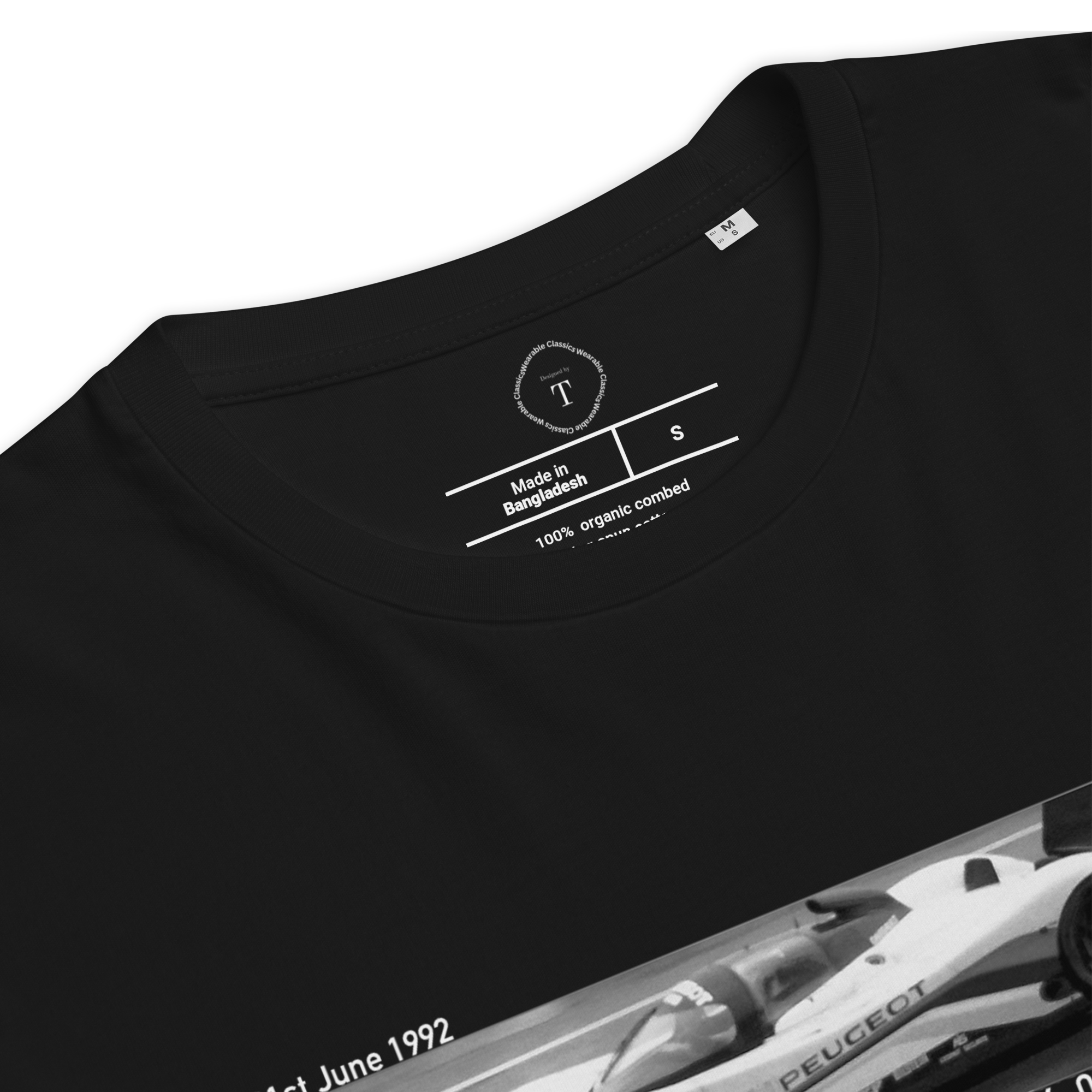 Black Unisex Cotton T-Shirt folded close up with banner image of Peugeot 1992 at Le Mans in the centre with text of coordinates and date of race