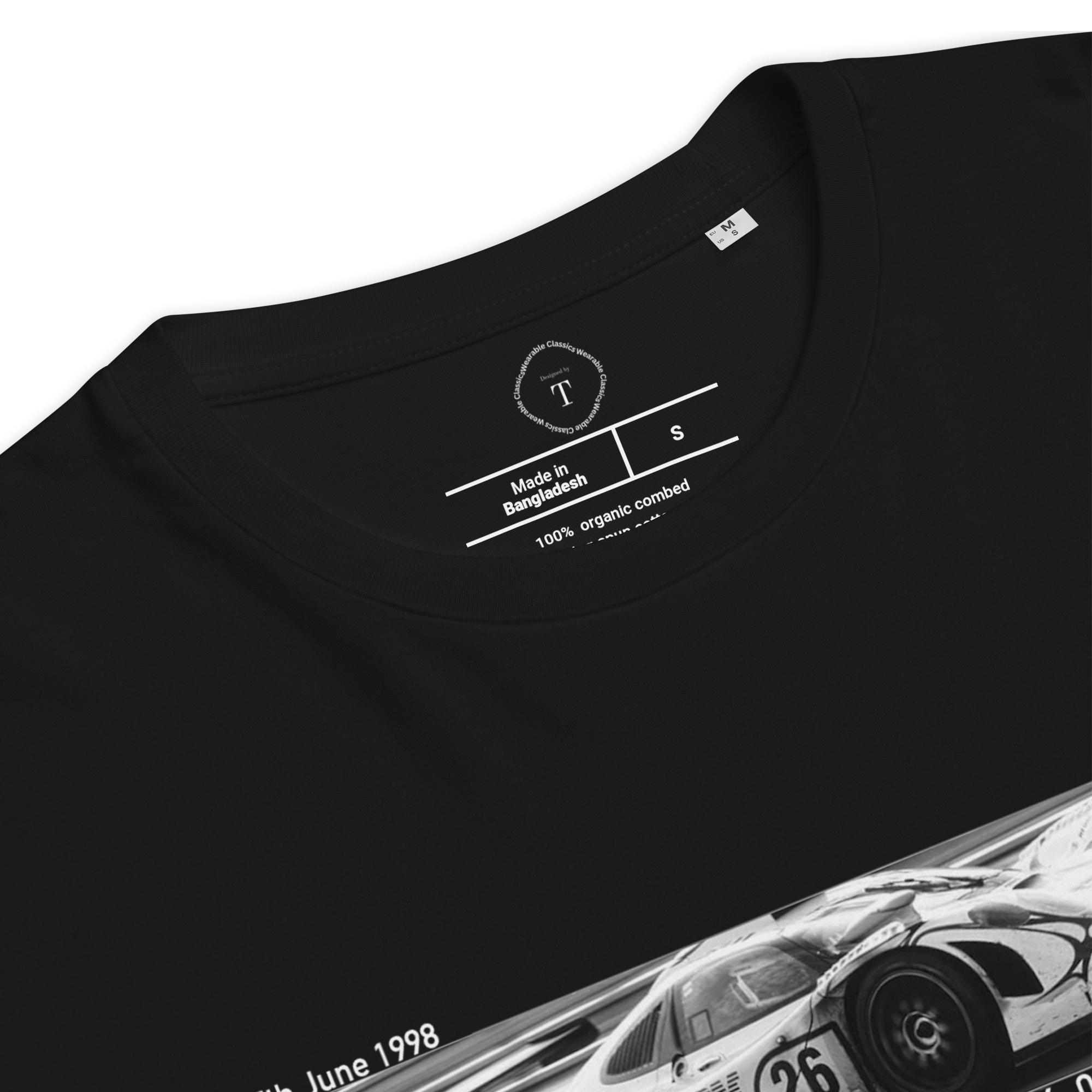 Black Unisex Cotton T-Shirt folded close up with banner image of Porsche 911 1998 at Le Mans in the centre with text of coordinates and date of race