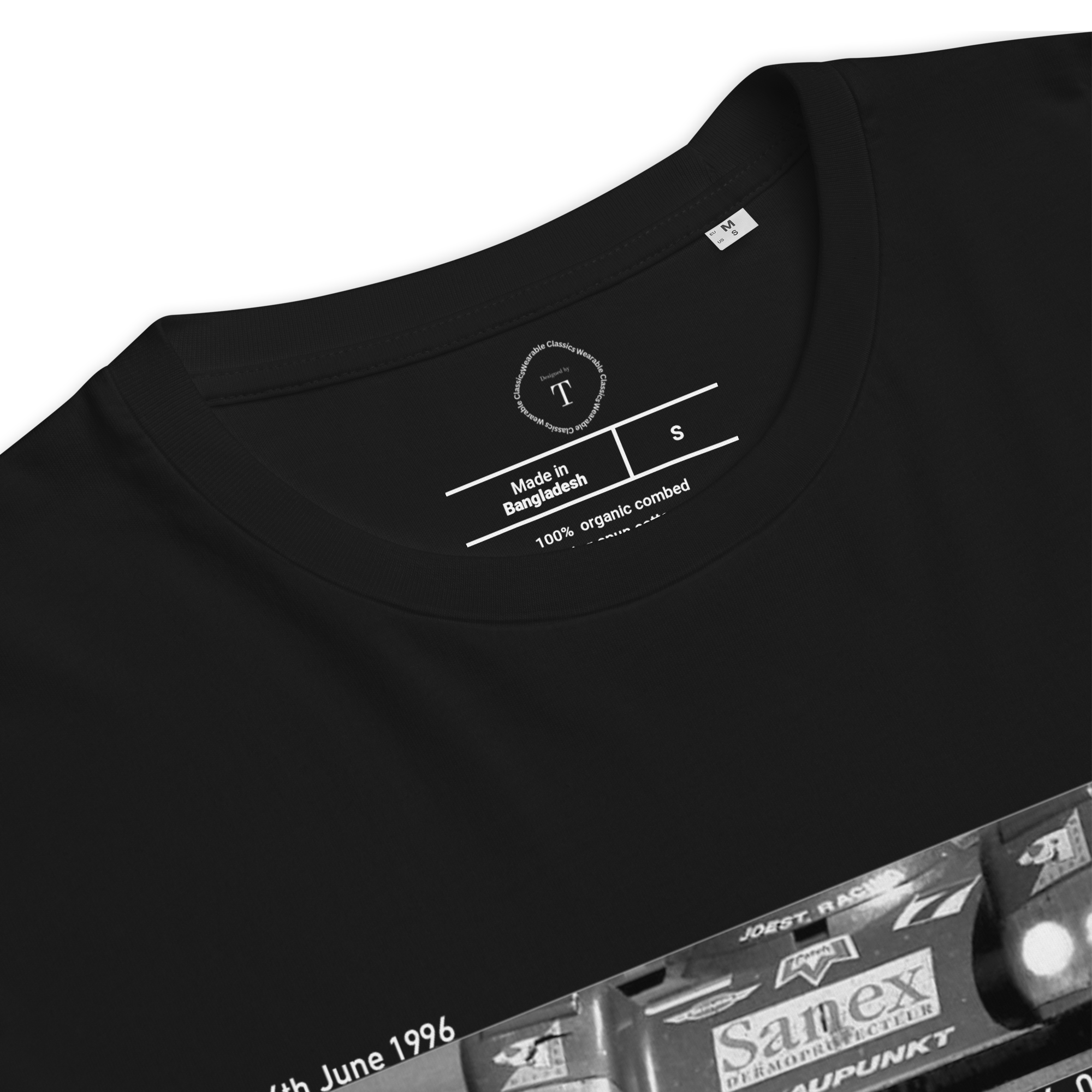 Black Unisex Cotton T-Shirt folded close up with banner image of Porsche 1996 at Le Mans in the centre with text of coordinates and date of race