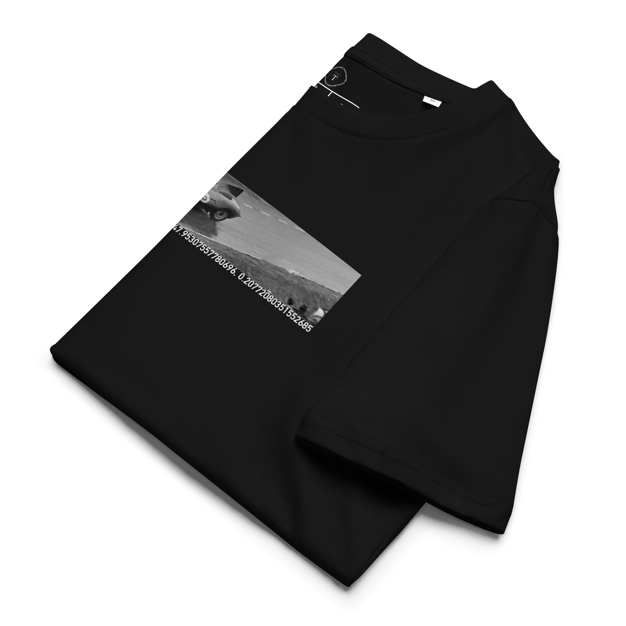 Black Unisex Cotton T-Shirt folded close up with banner image of 1955 Jaguar D Type at Le Mans in the centre with text of coordinates and date of race