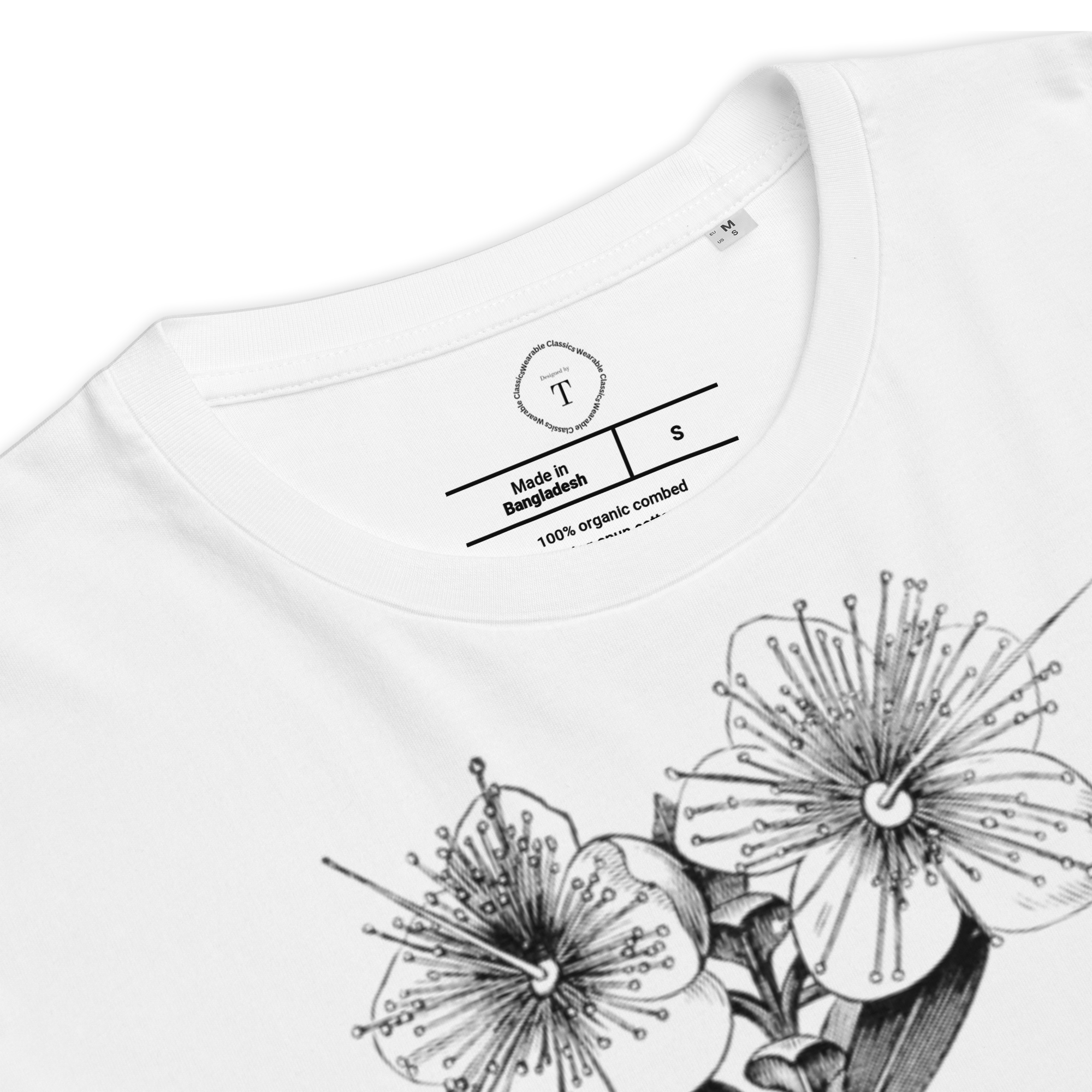 White Unisex Cotton T-Shirt folded close up with black and white image of flower in the centre