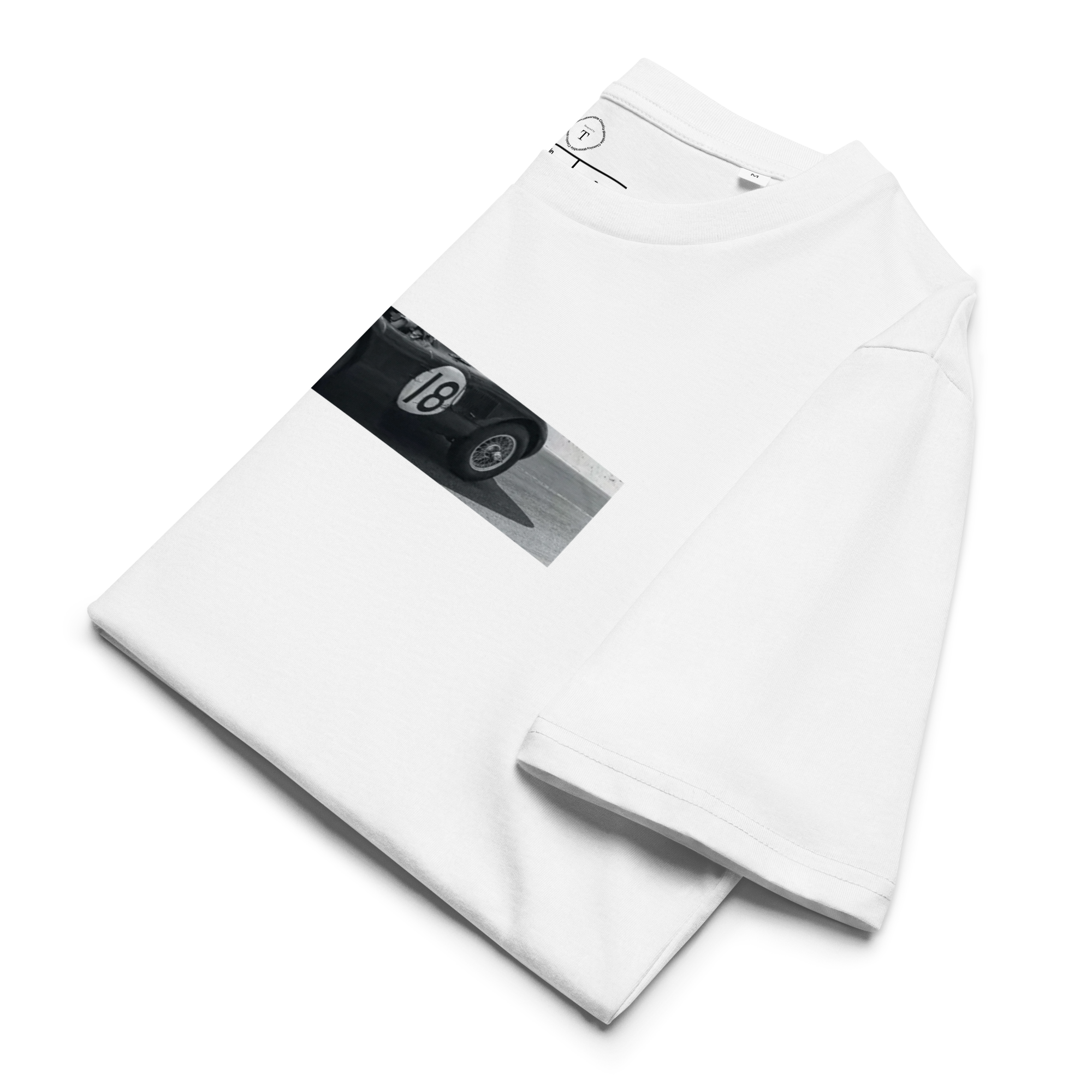 White Unisex Cotton T-Shirt folded close up with banner image of 1953 Jaguar C Type at Le Mans in the centre with text of coordinates and date of race