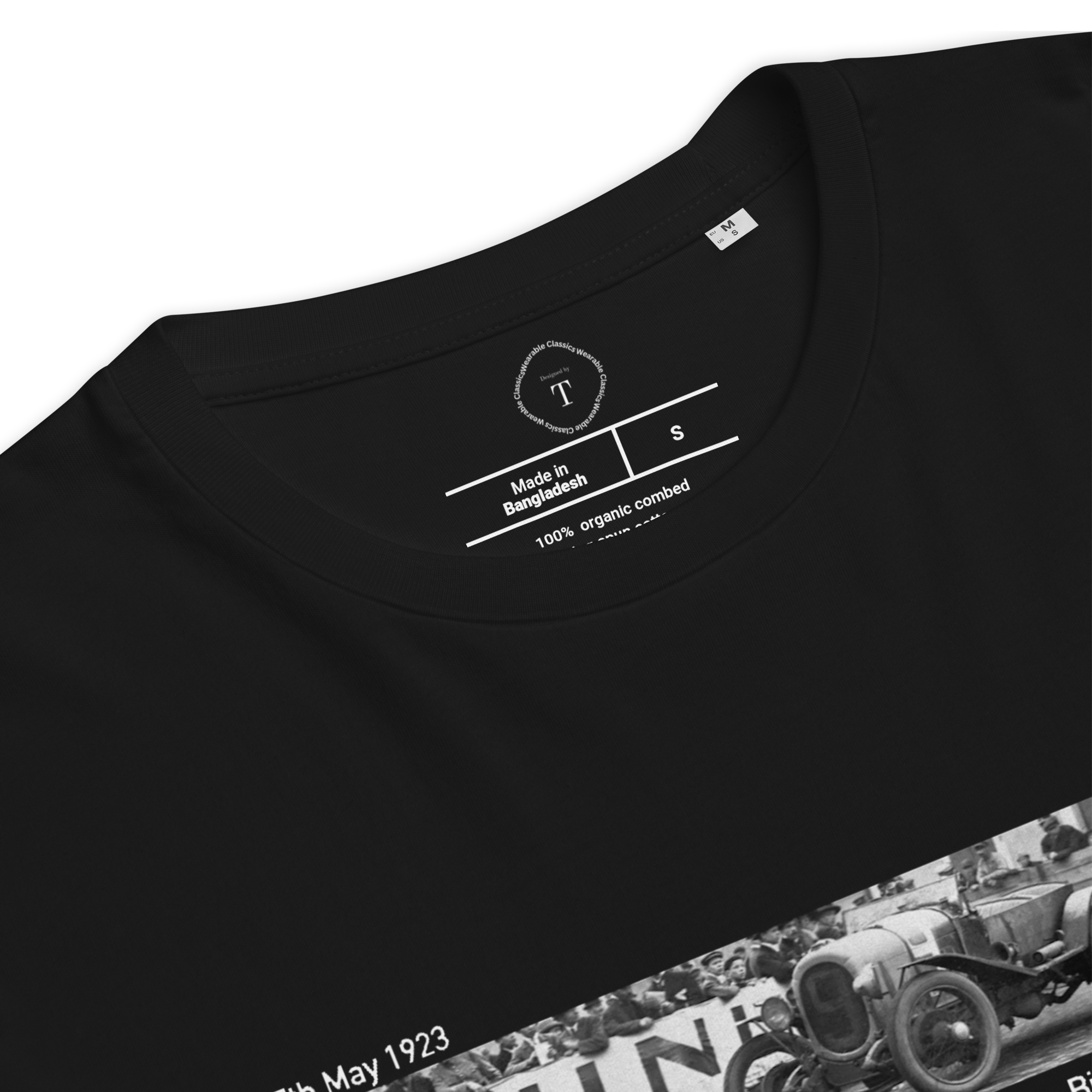 Black Unisex Cotton T-Shirt folded close up with banner image of Le Mans 1923 Victor in the centre with text of coordinates and date of race