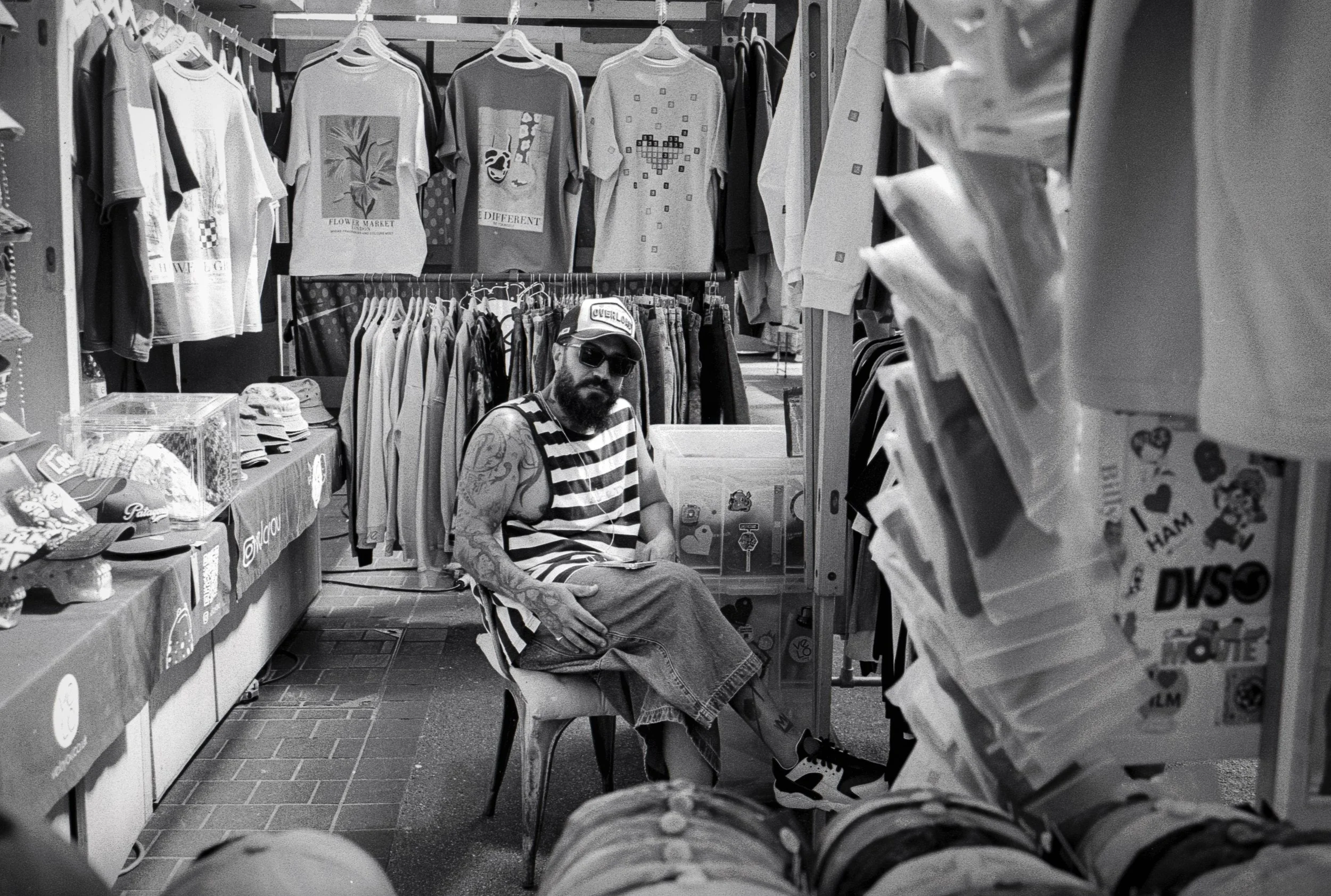 CLOTHES TRADER : Spitalfields,
August 2026. OM2 | TRI-X  400 (rated 640)  | 35mm at f11
