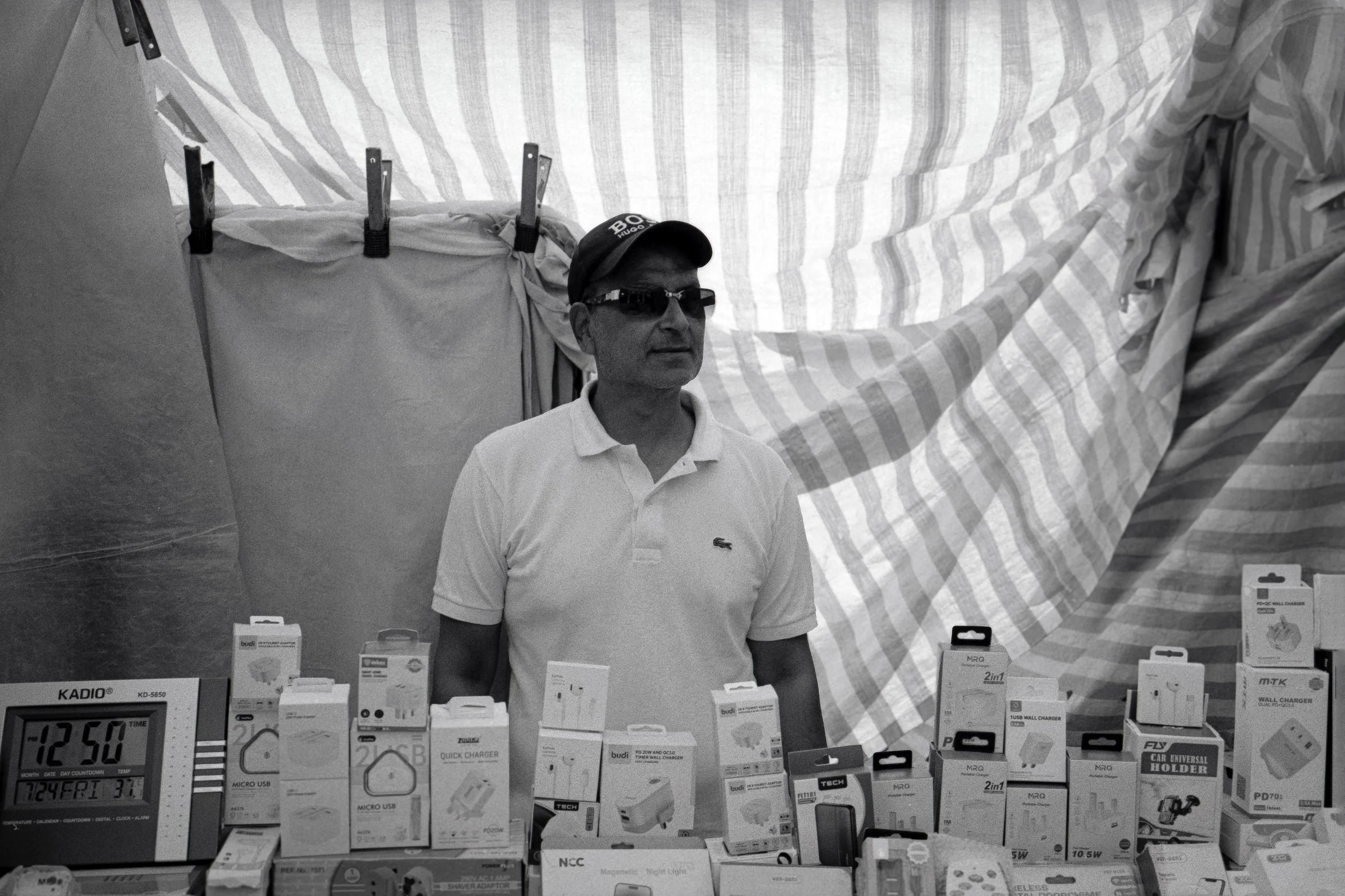 TECH STALL : Whitechapel Market,
July 2026. OM2 | TRI-X  400 (rated 800)  | 35mm at f11