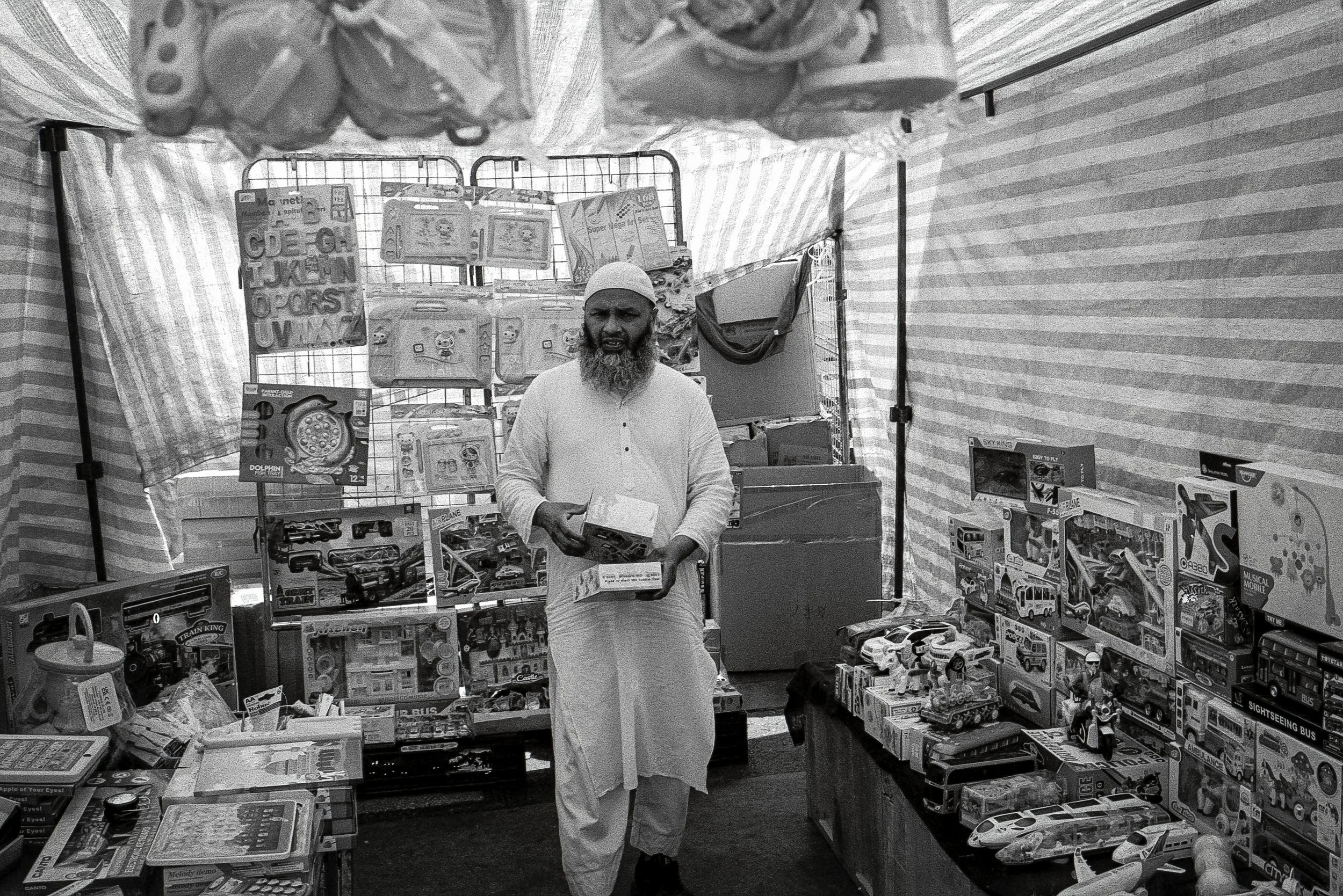 TOY STALL : Whitechapel Market,
July 2026. OM2 | TRI-X  400 (rated 800)  | 35mm at f11
