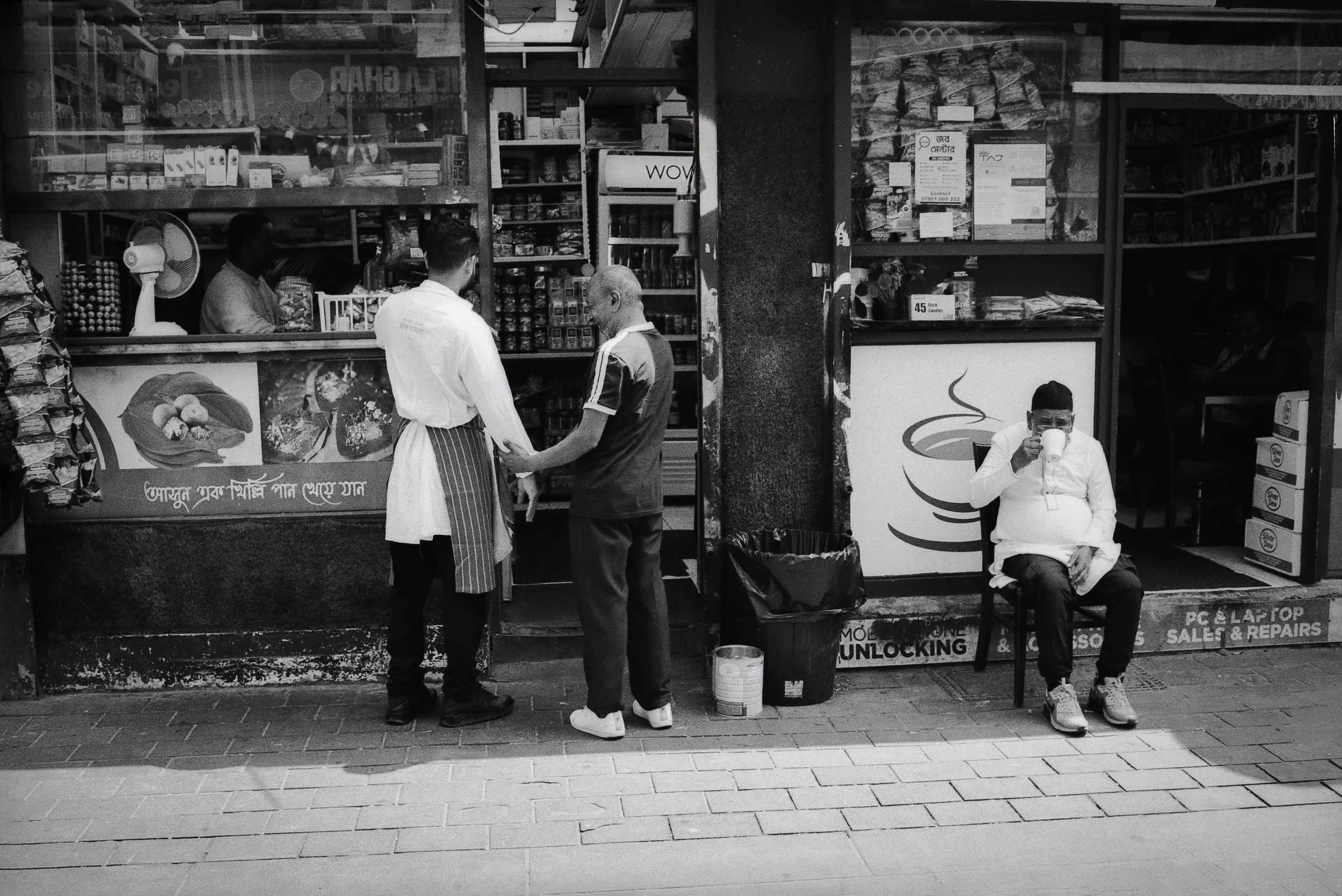 FAMILY SHOP FRONT : Whitechapel Market,
July 2026. OM2 | TMax 400 (rated 640)  | 35mm at f11