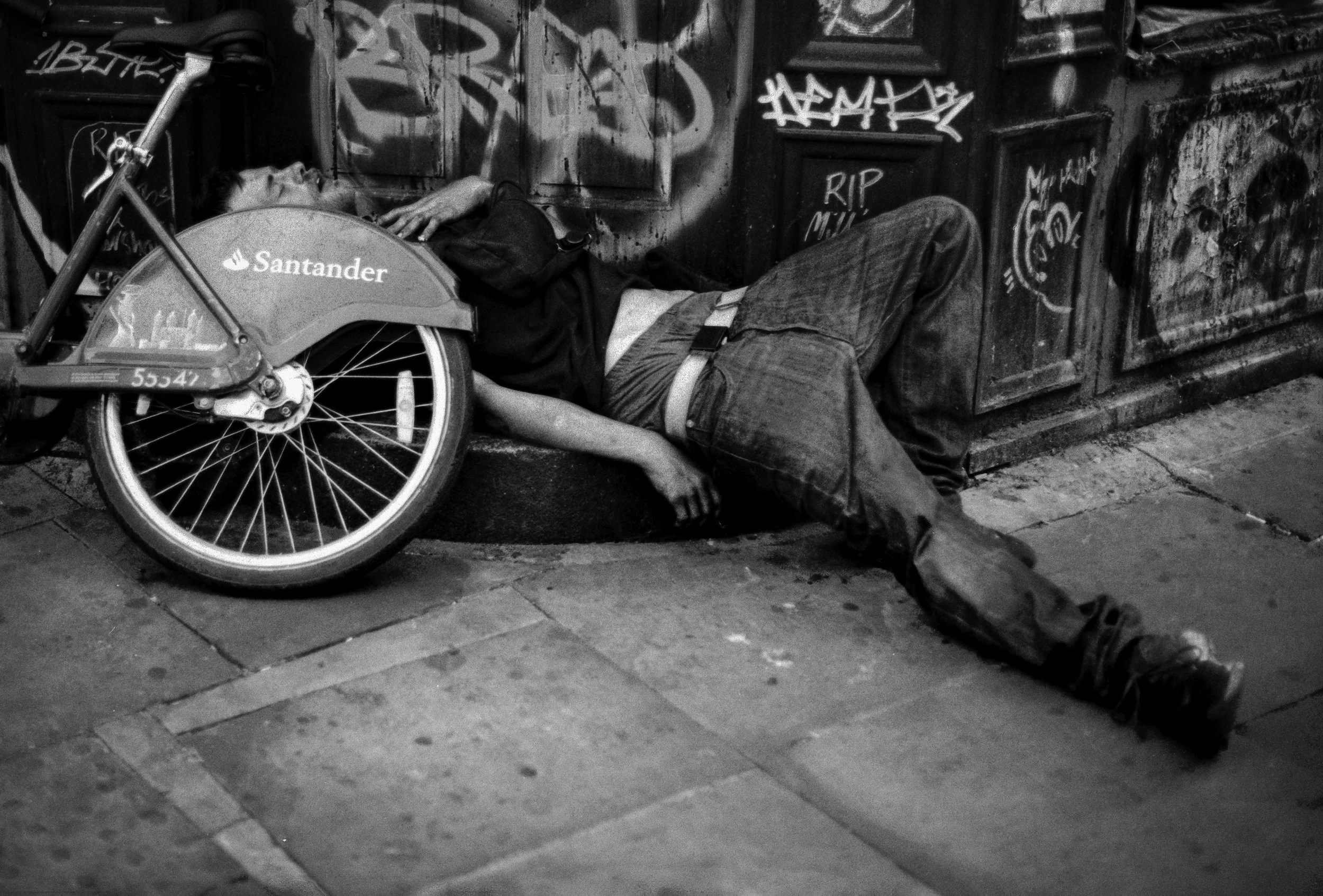 ASLEEP : Brick Lane,
July 2026. OM2 | TMax 400 (rated 640)  | 50mm at f5.6