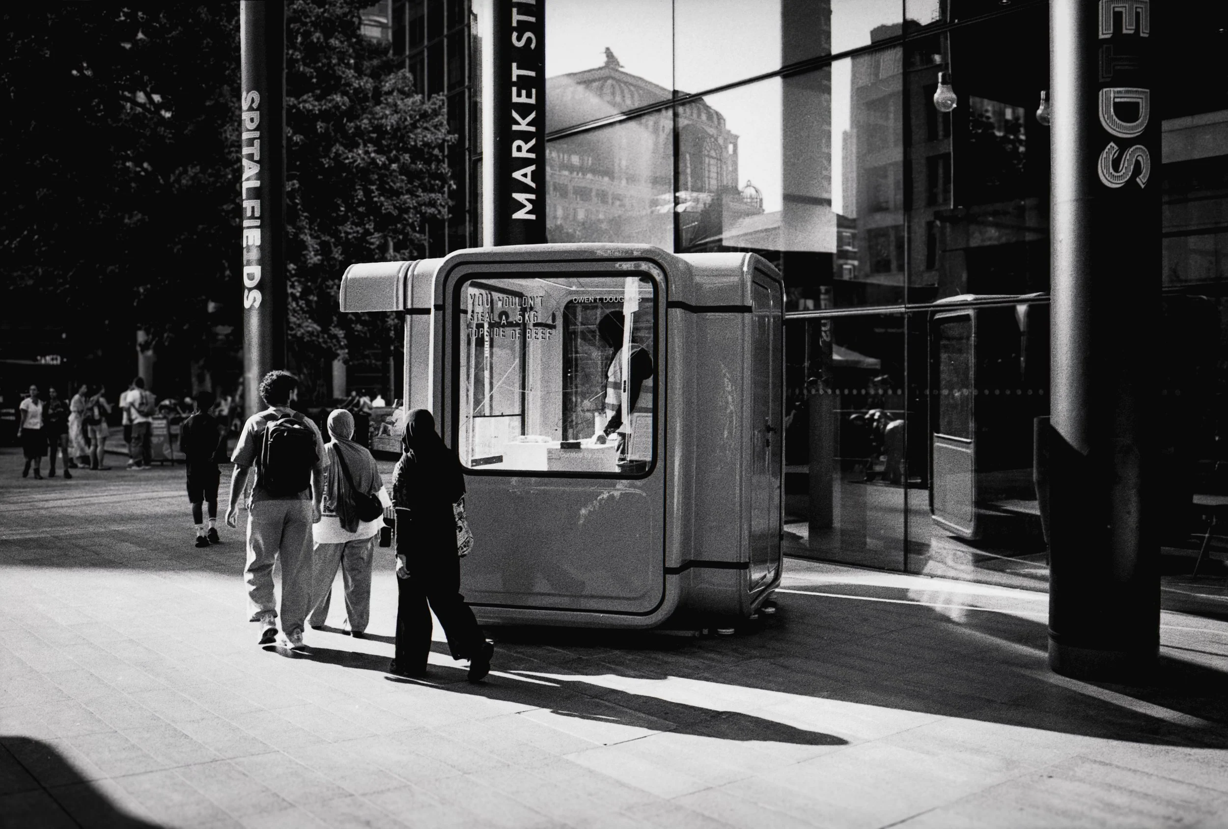 EXHIBITOIN FEATURE : Spitalfields,
August 2026. OM2 | TRI-X  400 (rated 640)  | 35mm at f11
