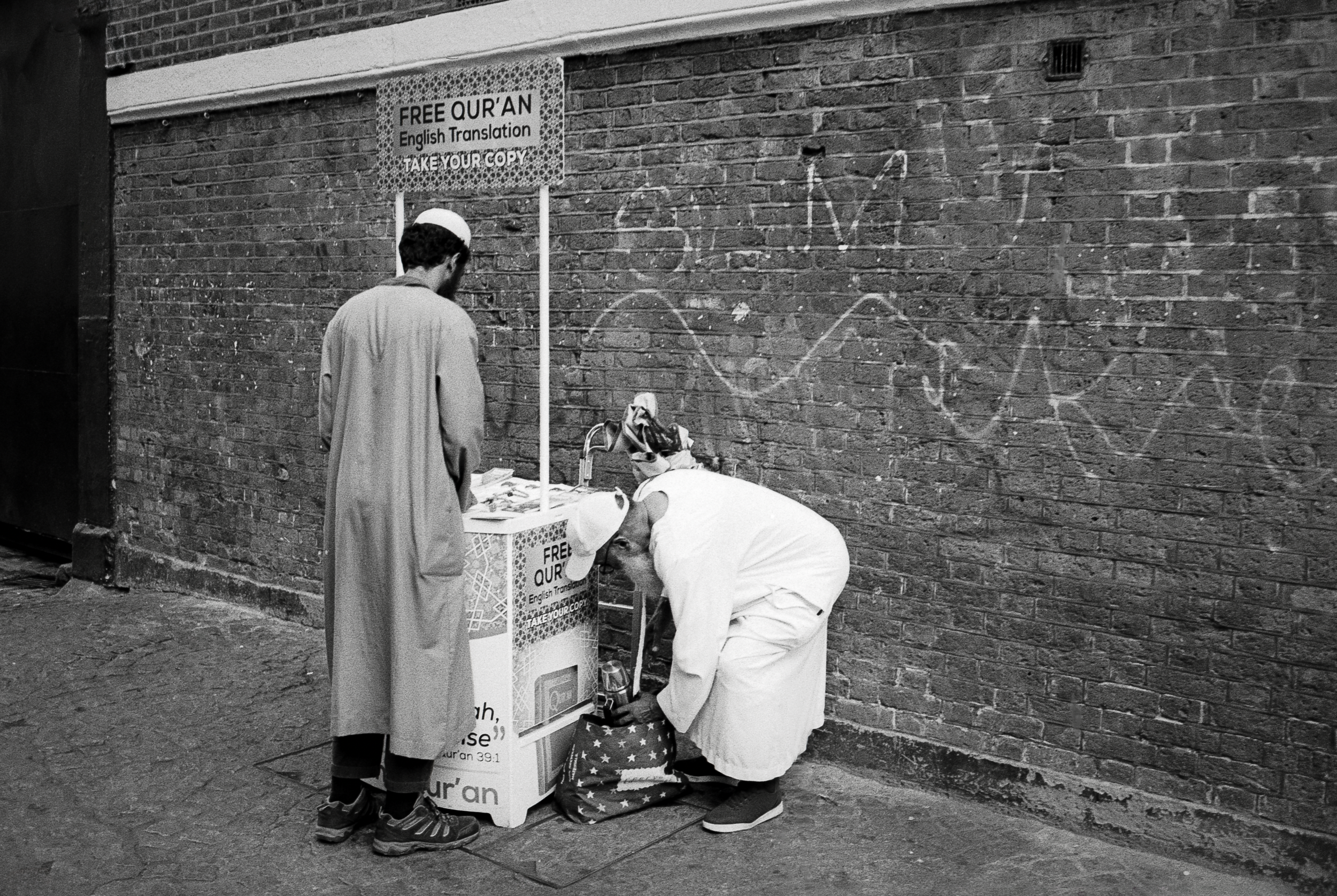 RELIGION TRANSLATED : Brick Lane,
July 2026. OM2 | TRI-X 400 (rated 640)  | 35mm at f11