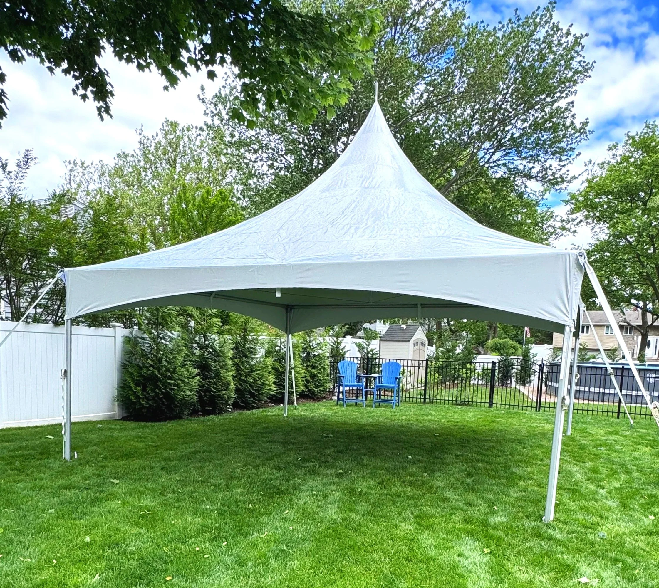 A white 20x20 high peak tent rental at a backyard birthday party.