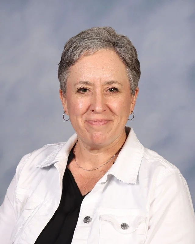 A navy blue shield with military-style crossed arrows and a lightning bolt, and the letters 'C' and 'K' in the center.