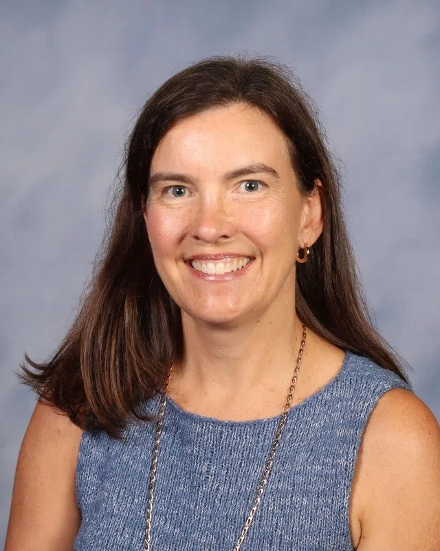 A shield emblem with a stylized monogram of the letters 'C' and 'K' in blue and white, featuring a lightning bolt and an arrow, symbolizing strength and speed.