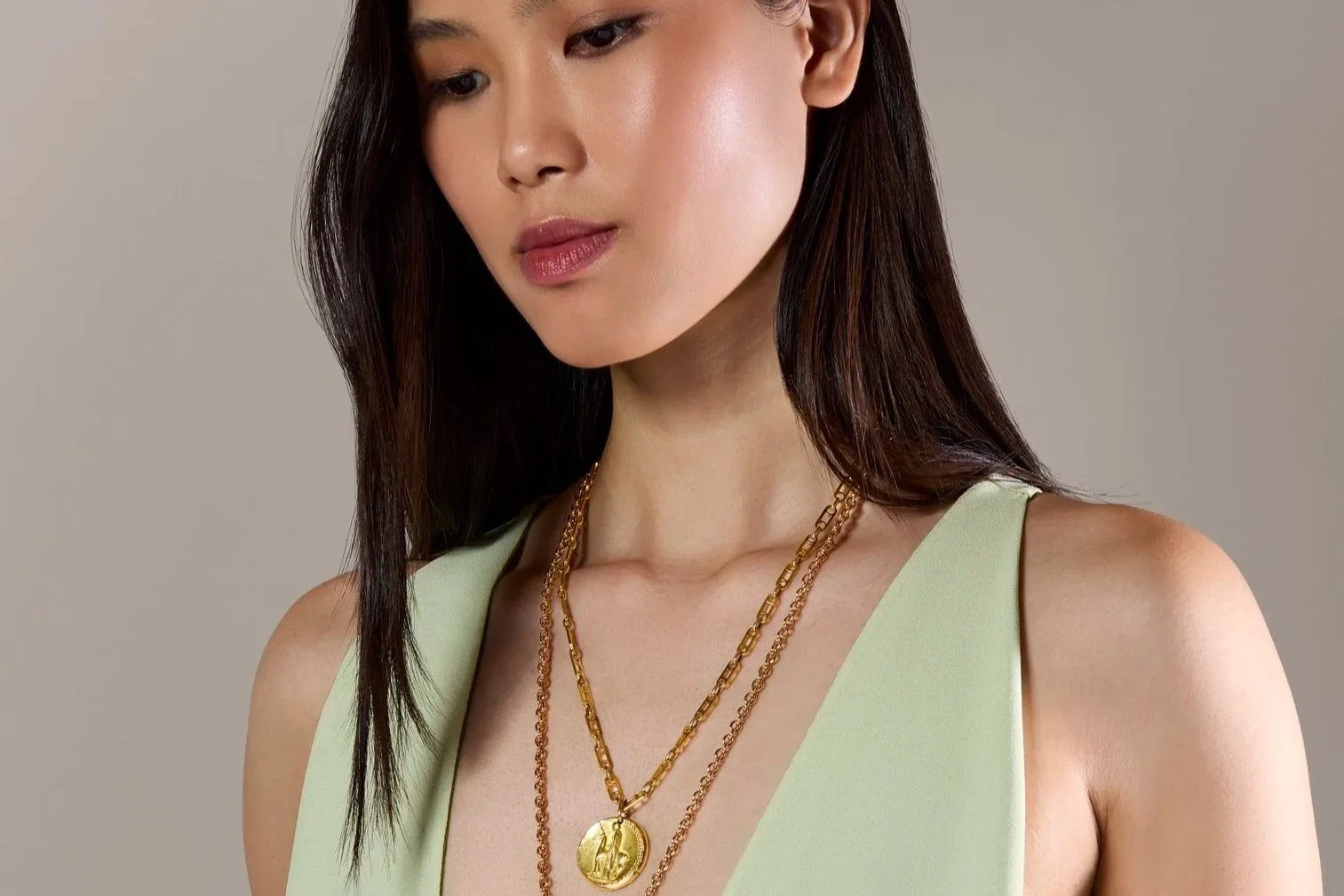 clean professional makeup on asian model glowing and natural soft glam from a photoshoot in Boston