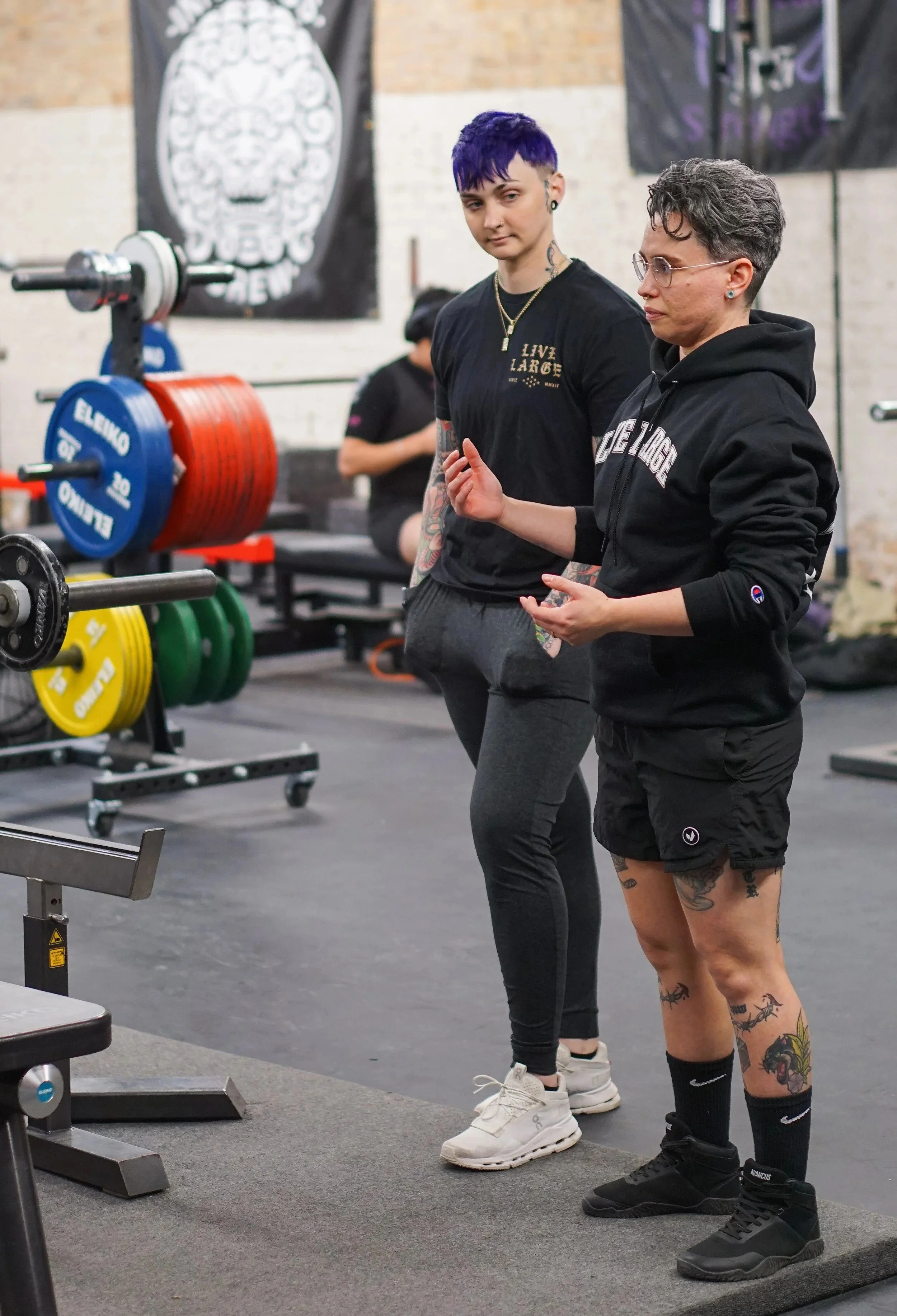 Coaches Melissa and Riley teaching