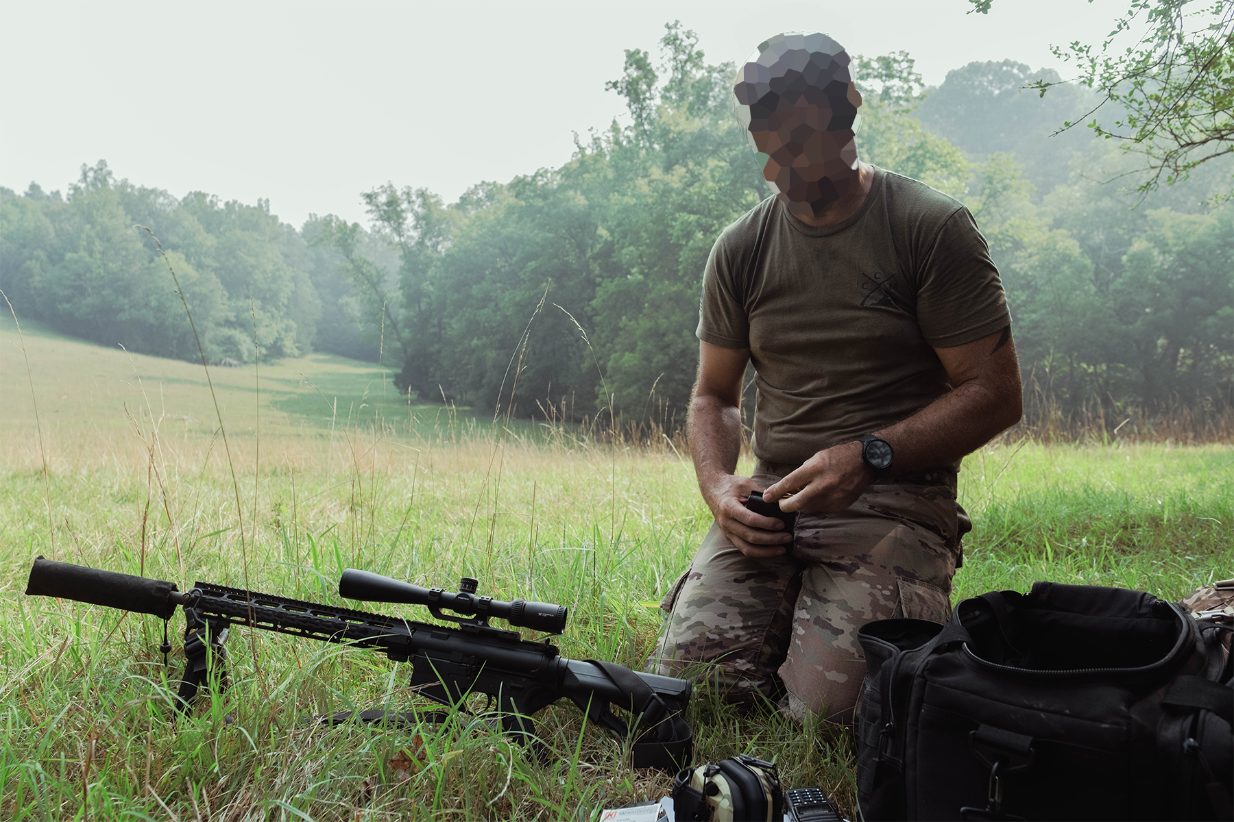 A member of the militia loads a .308 magazine for an AR-10. July 18, 2026.