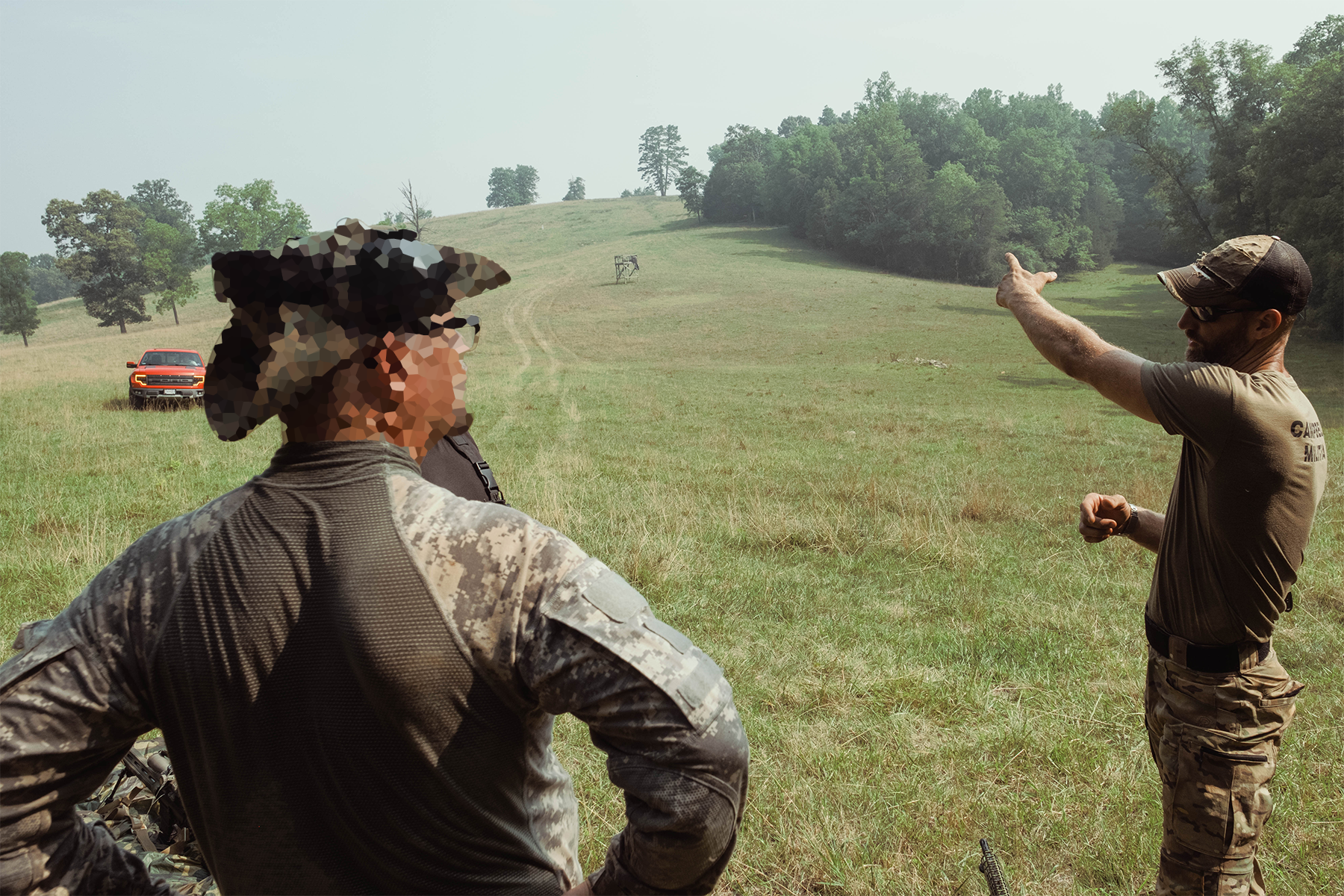 Dan Abbott explaining marksmanship basics to a militiaman. July 18, 2026.