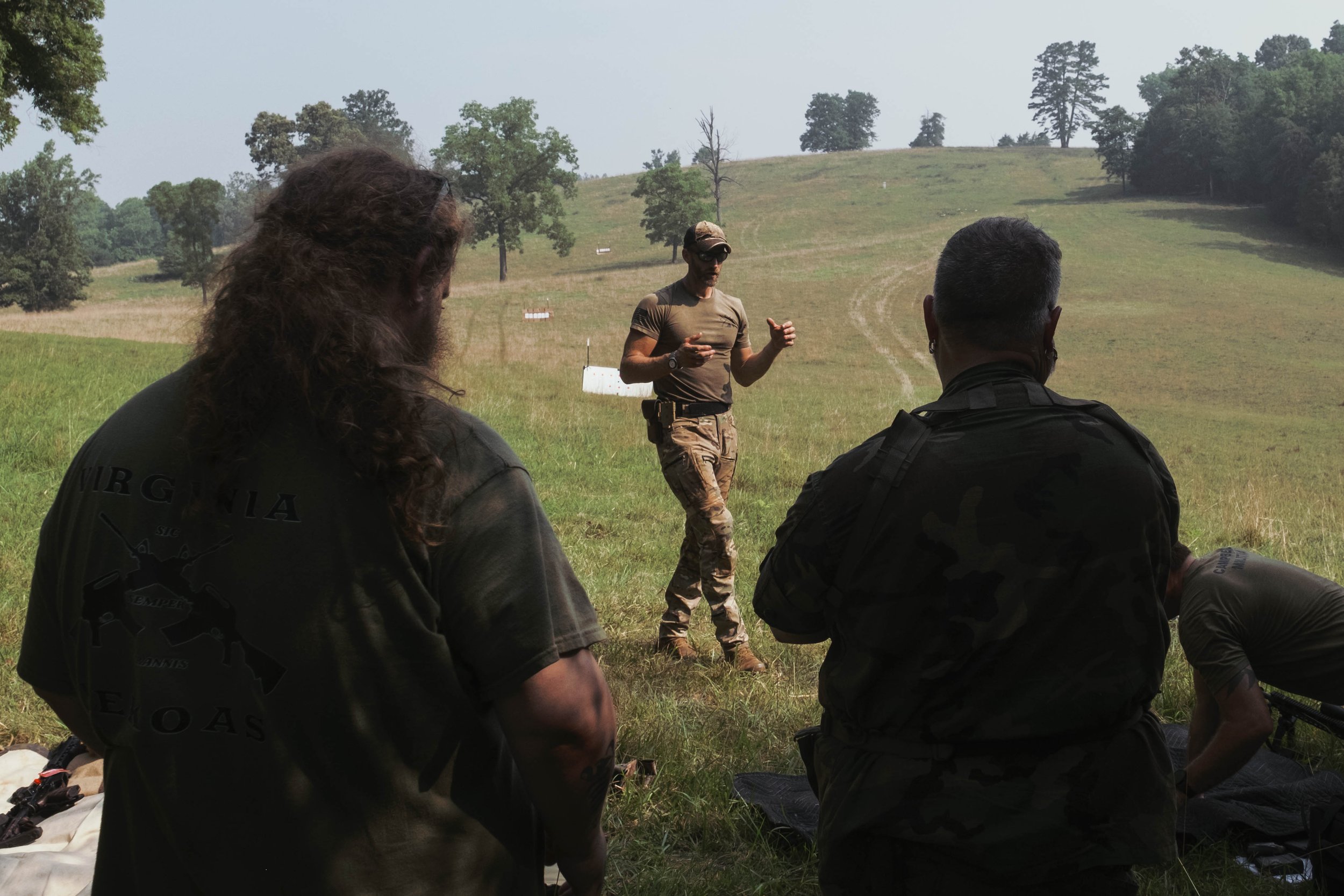 Dan Abbott lecturing militiamen on long-range fire. July 18, 2026.