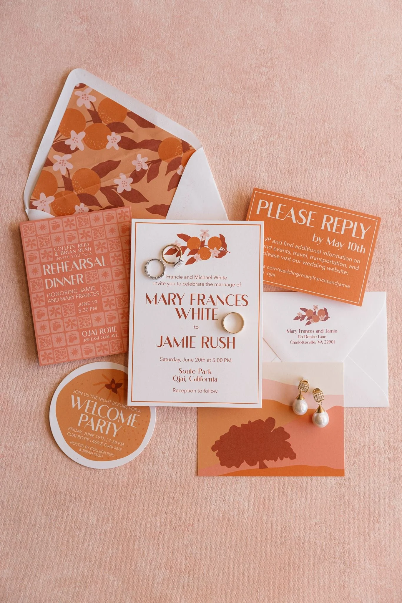 Invitation cards for a wedding, jewelry, and event details on a pink background.
