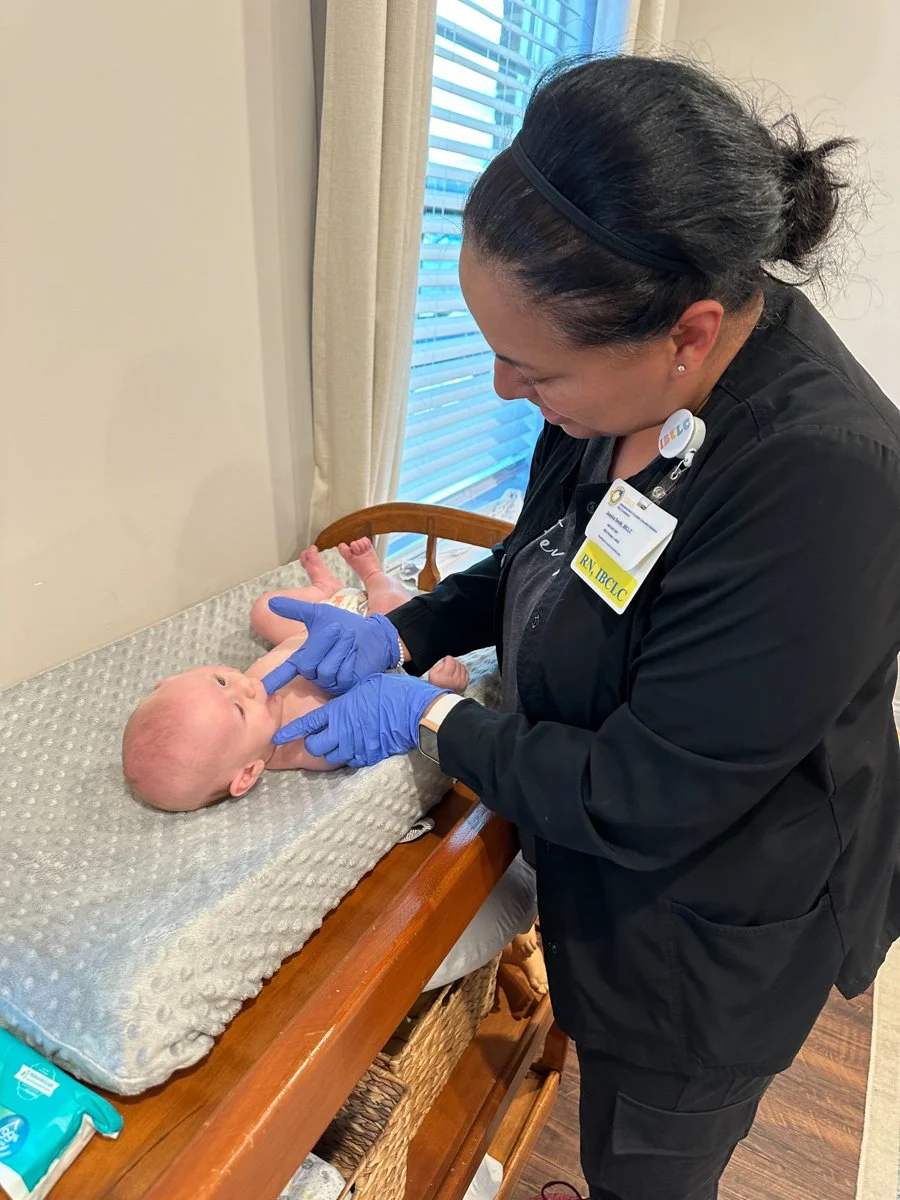 A lactation consultant taking care of a baby in Lynchburg, VA.