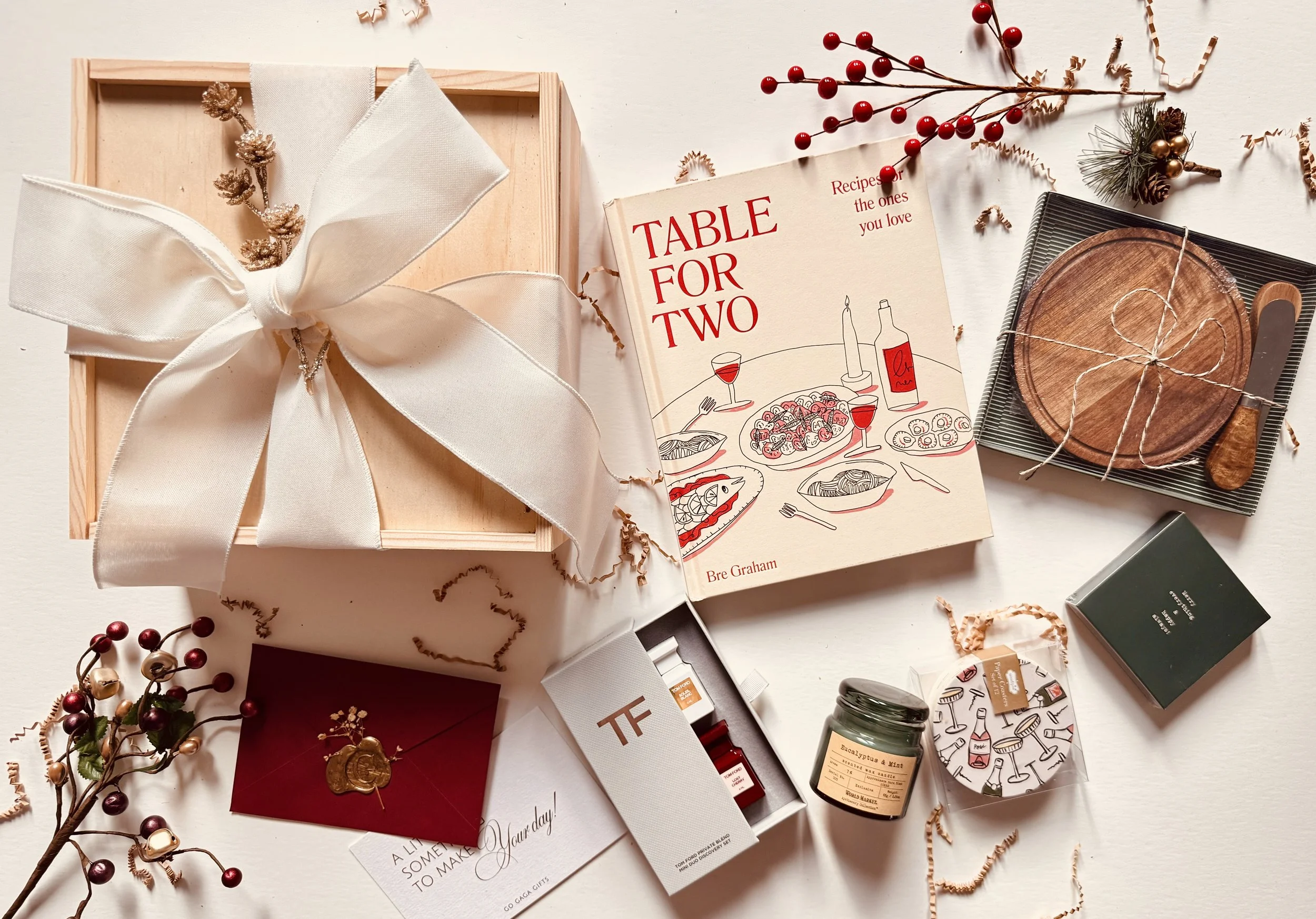 Holiday gift box for couples including cookbook, candle, fragrance, and card
