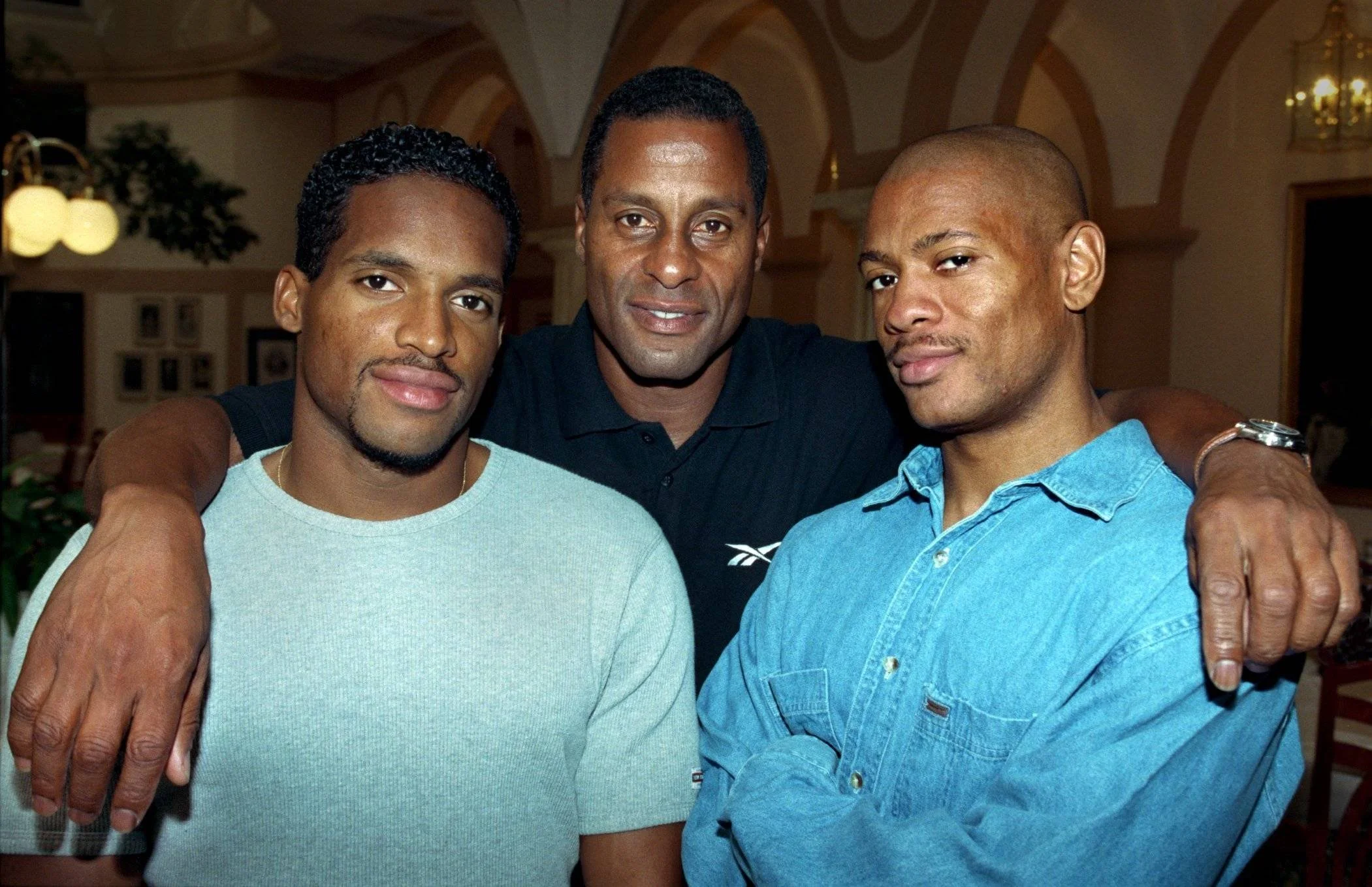 LA native, 1972 Olympian and Iconic athletics coach John Smith alongside two of his athletes and Olympic medallists Ato Boldon and Maurice Greene