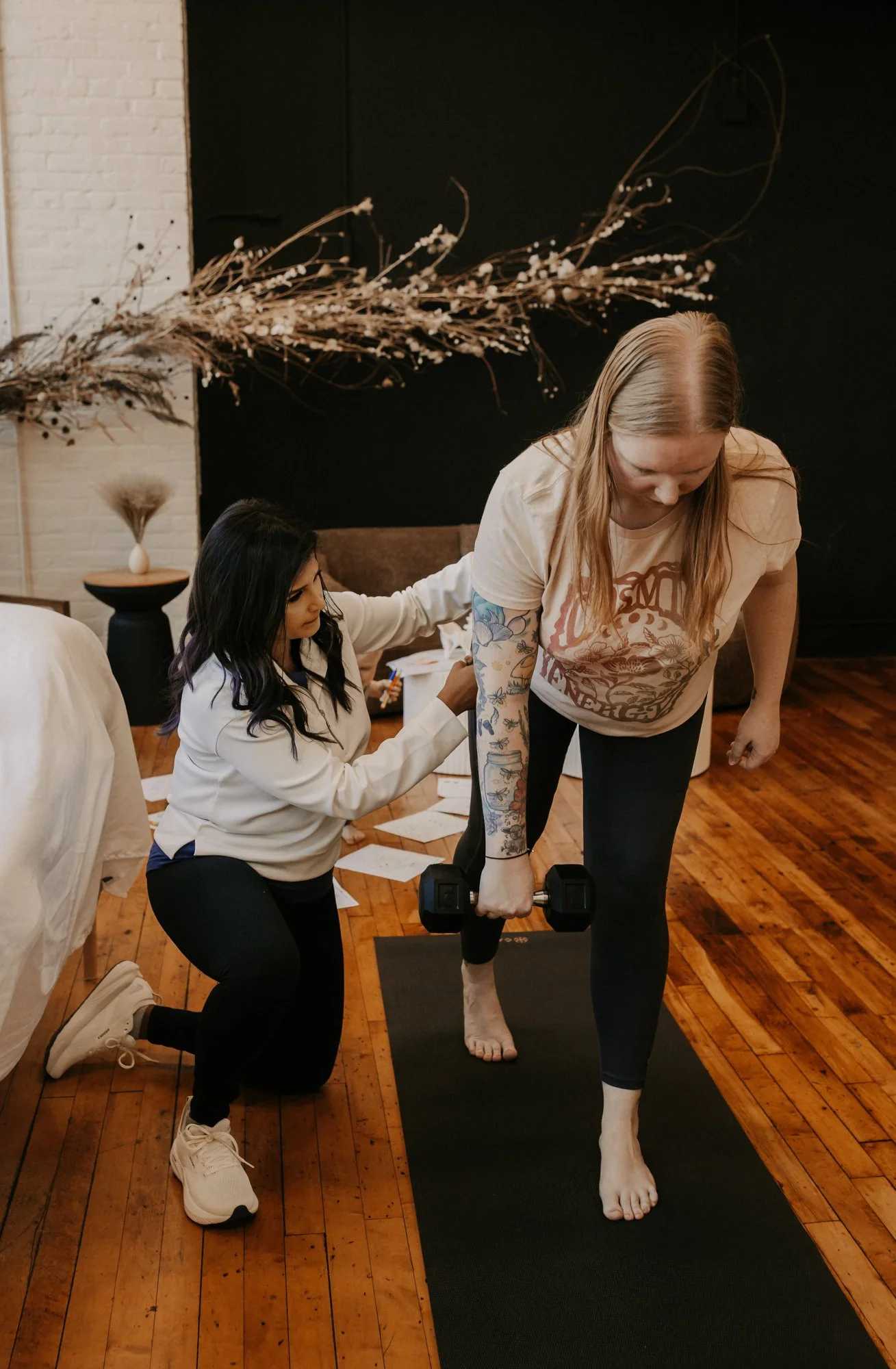Dr. Sheron Dsouza working with a patient on single leg exercises at a pelvic floor therapy session