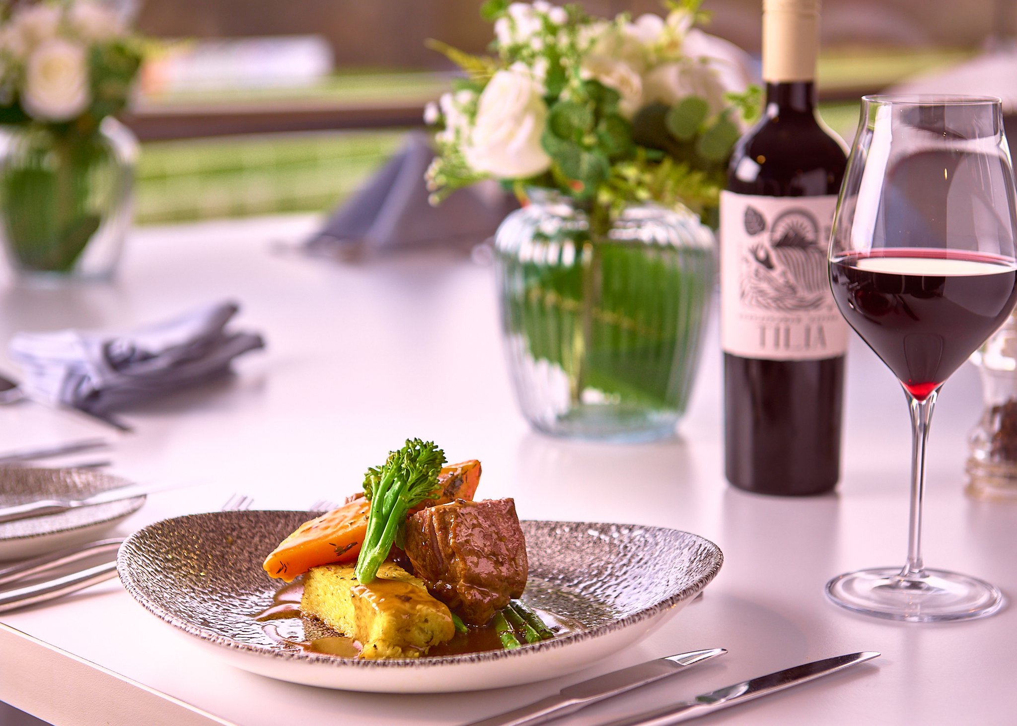 Hamilton Park Racecourse meat dish with bottle – restaurant food photography Scotland