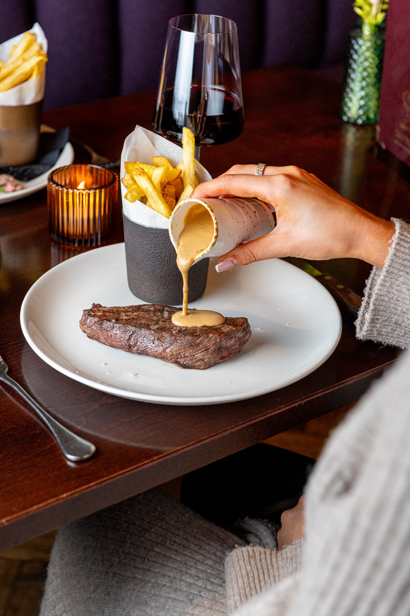 Gost Bar Restaurant Glasgow steak with sauce pour – food photography Glasgow