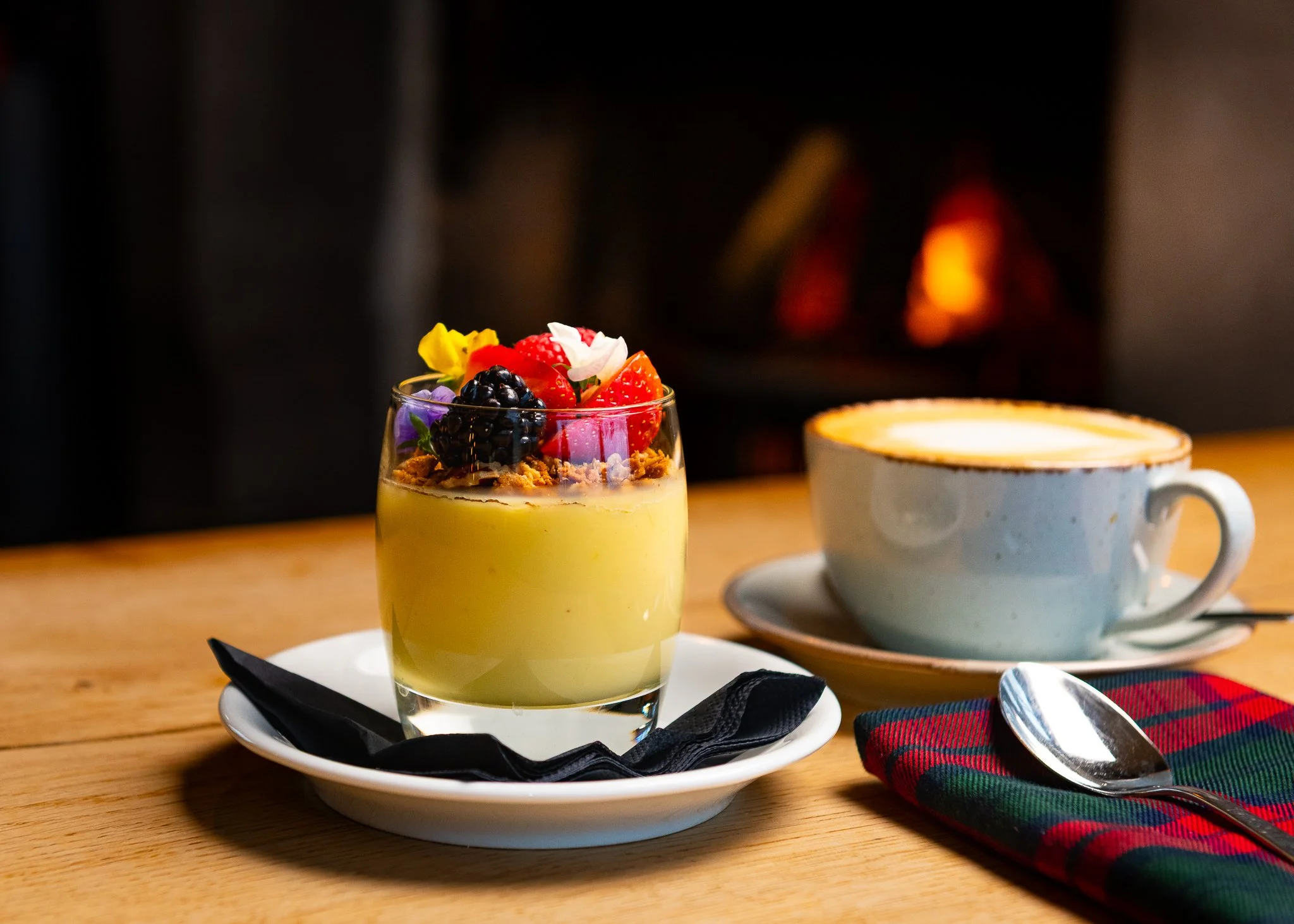 Karma Lake of Monteith dessert by fireplace – hotel restaurant photography Scotland