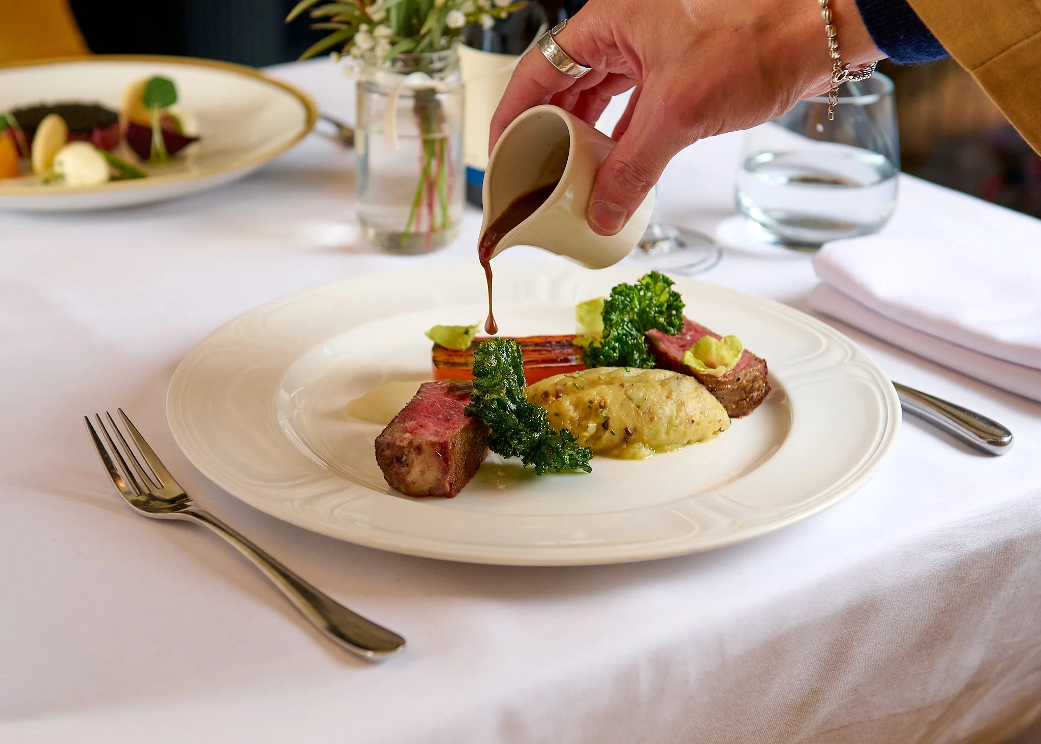 Roseate Edinburgh lamb with sauce pour – fine dining food photography Edinburgh Scotland
