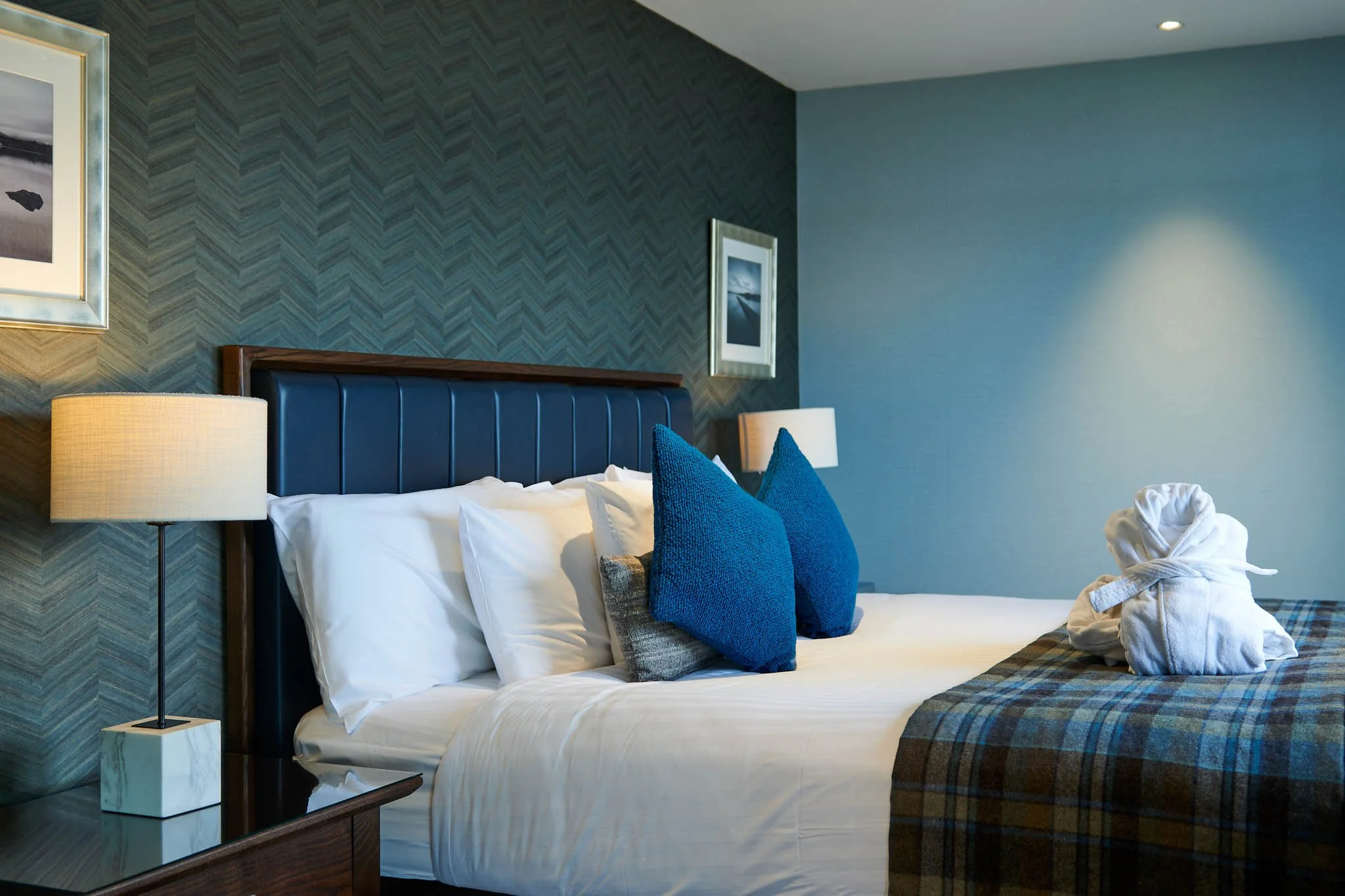 Lodge on Loch Lomond guest bedroom blue headboard – hotel interior photography Scotland