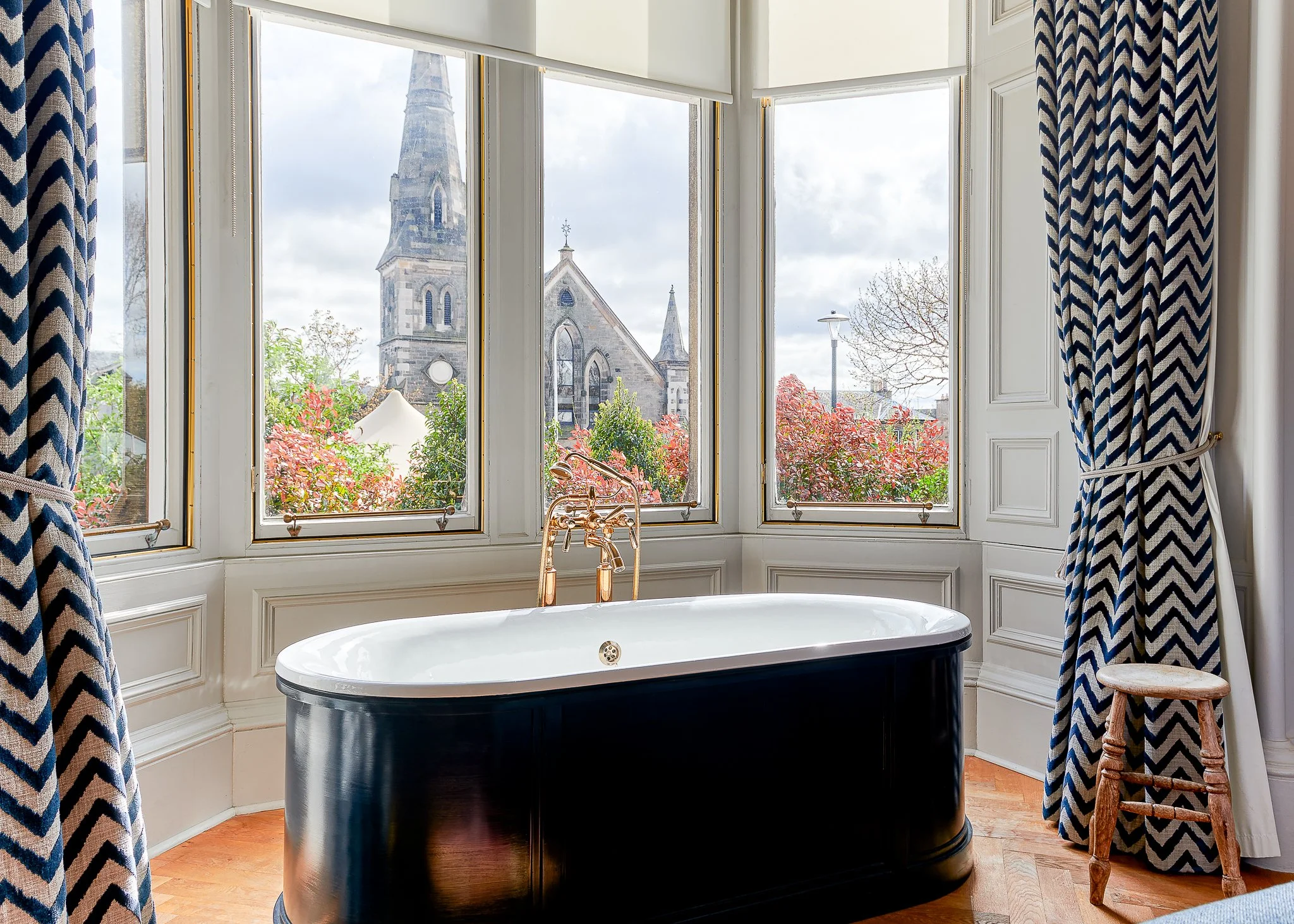 Roseate Edinburgh freestanding bath with church views – hotel interior photography Edinburgh