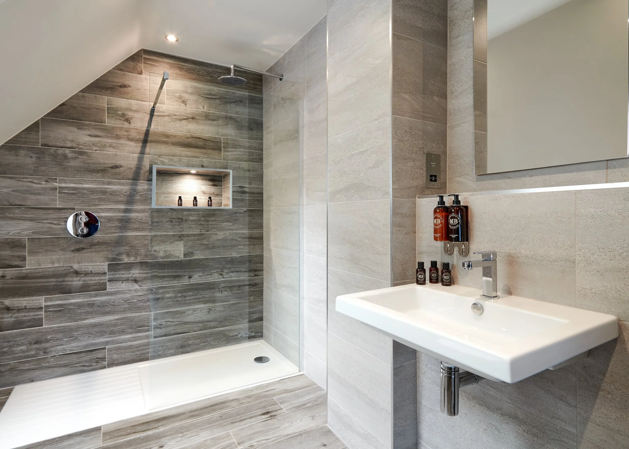Modern bathroom with walk-in shower and stone wall tiles, clean contemporary interior design