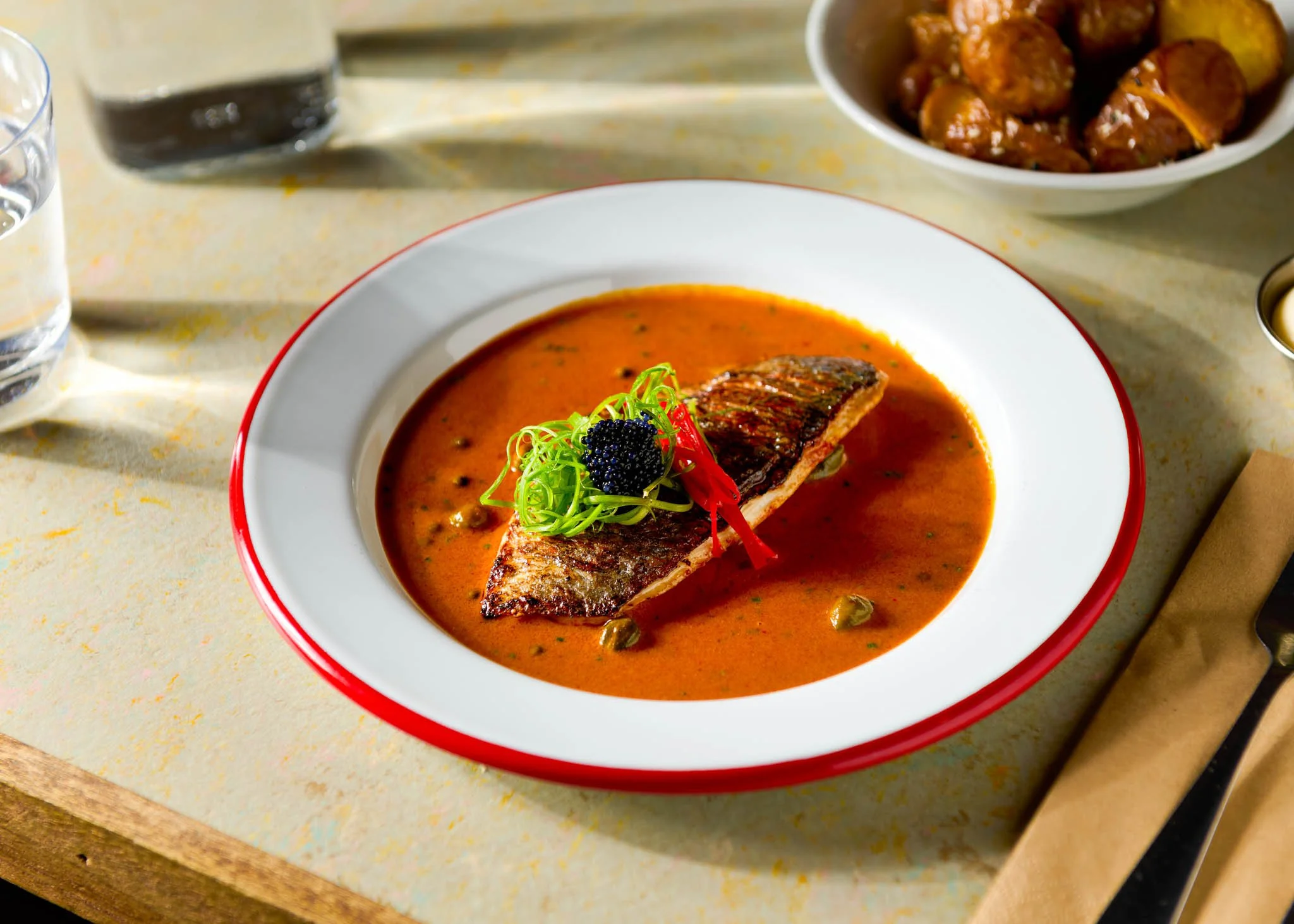 GaGa Glasgow spiced fish dish red bowl – restaurant food photography Glasgow