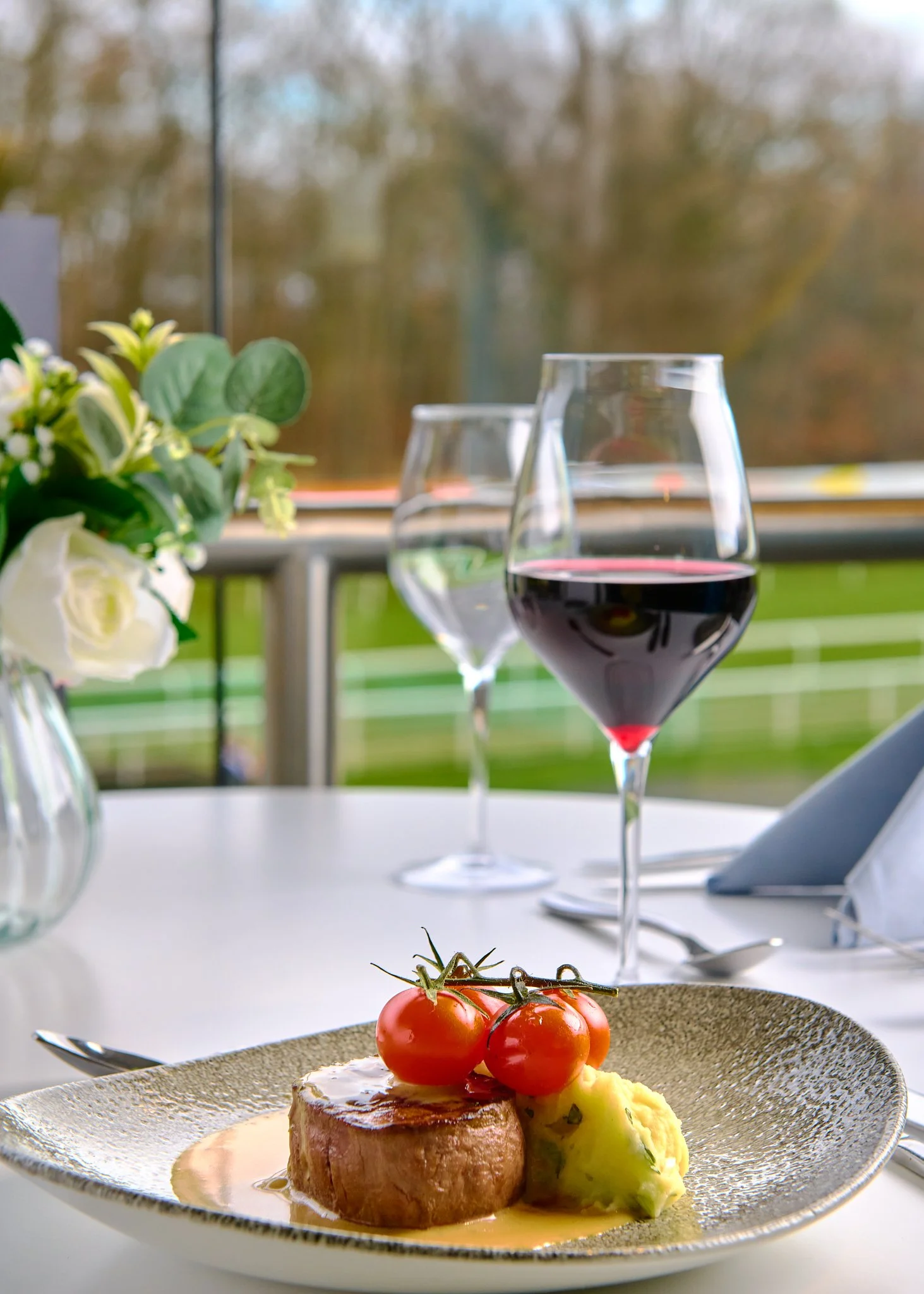 Hamilton Park Racecourse table setting with red wine – hospitality photography Glasgow