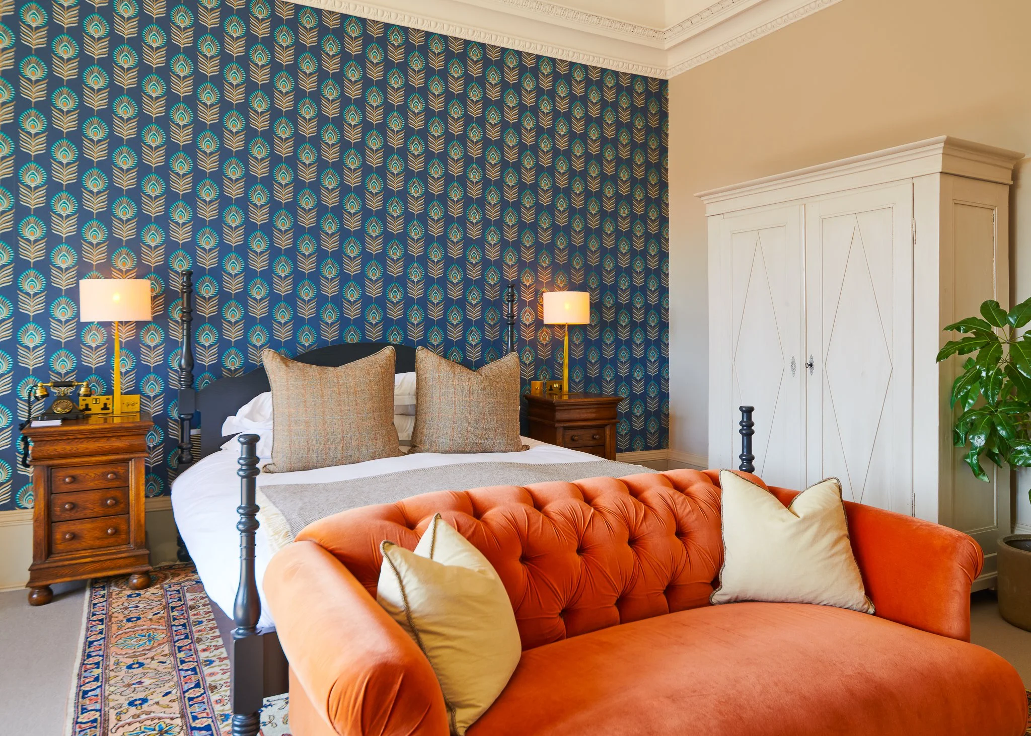 Roseate Edinburgh bedroom with tufted sofa and wallpaper – boutique hotel interior Edinburgh