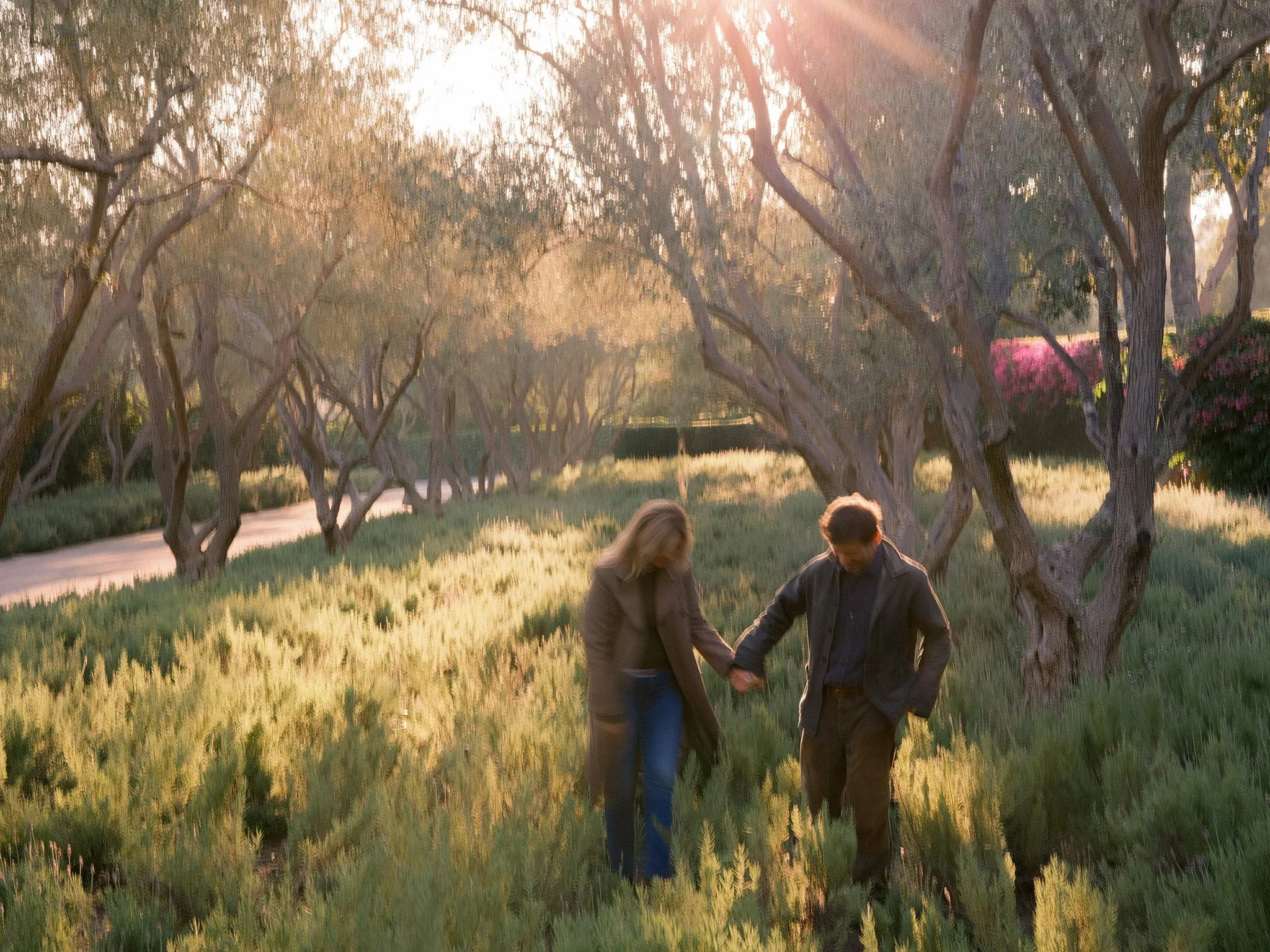 04-debbie-zack-snyder-anniversary-couple-walking-field-sunlight.jpg.JPG