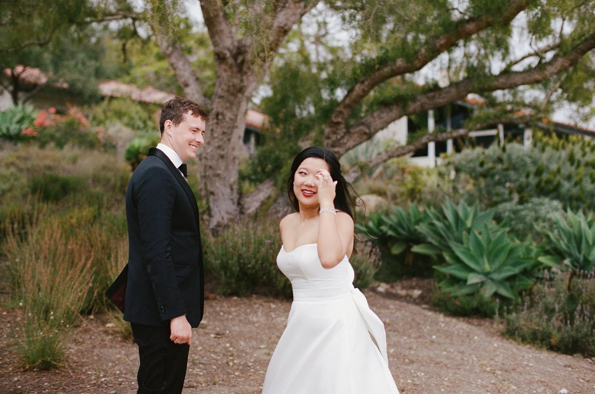 bride and groom standing outdoors photographed by Michael and Anna Costa