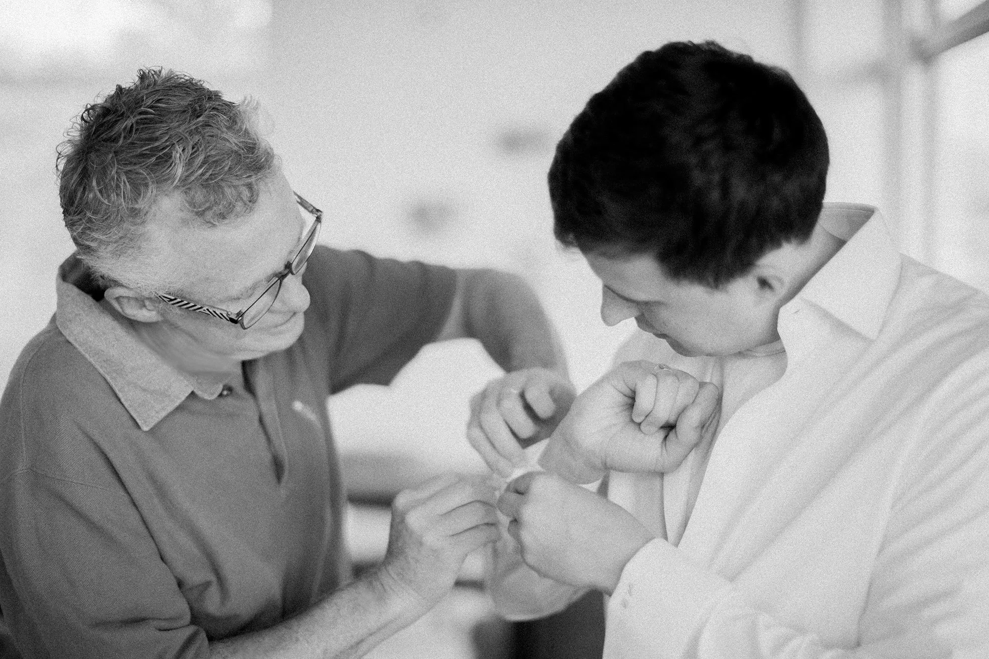 a groom and his father preparing for the big day photographed by Michael and Anna Costa